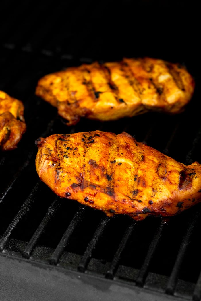 Chipotle grilled chicken on the grill.