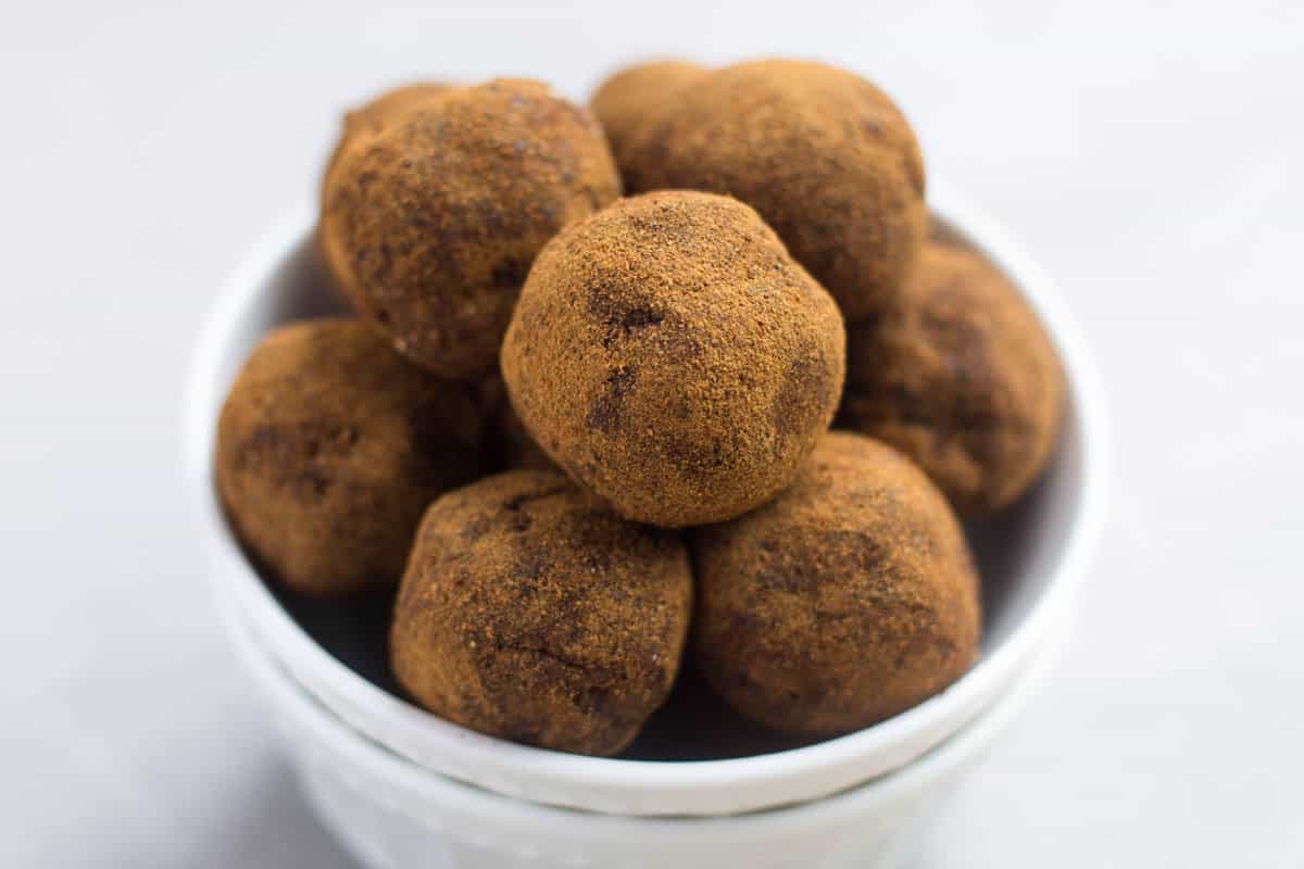 Classic fall flavors make their way into these Pumpkin Cinnamon Raisin Balls for the perfect snack or energy ball pick-me-up. Vegan, paleo, and Whole30 approved! - Eat the Gains