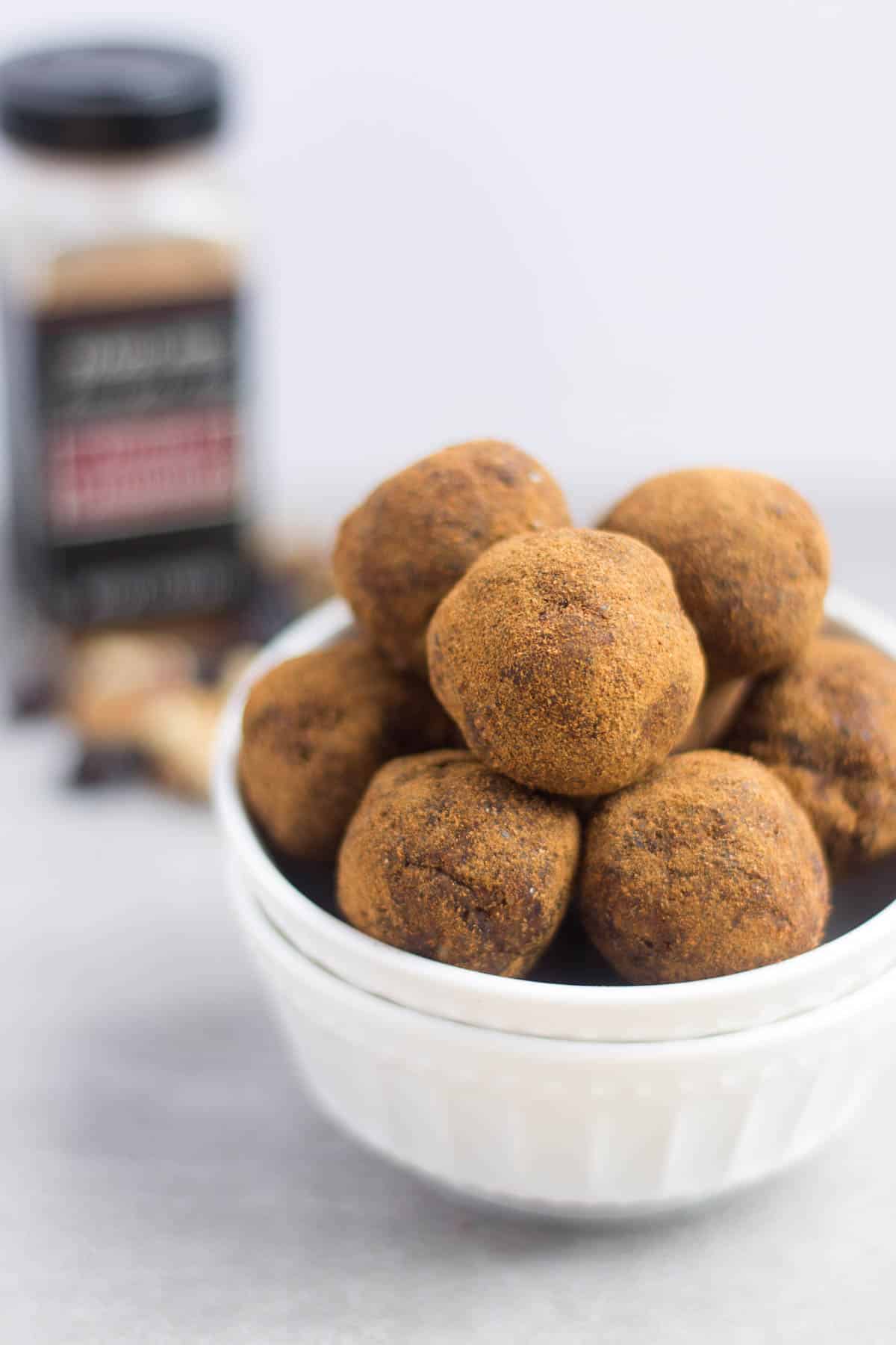 Classic fall flavors make their way into these Pumpkin Cinnamon Raisin Balls for the perfect snack or energy ball pick-me-up. Vegan, paleo, and Whole30 approved! - Eat the Gains
