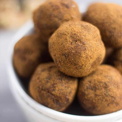 Classic fall flavors make their way into these Pumpkin Cinnamon Raisin Balls for the perfect snack or energy ball pick-me-up. Vegan, paleo, and Whole30 approved! - Eat the Gains
