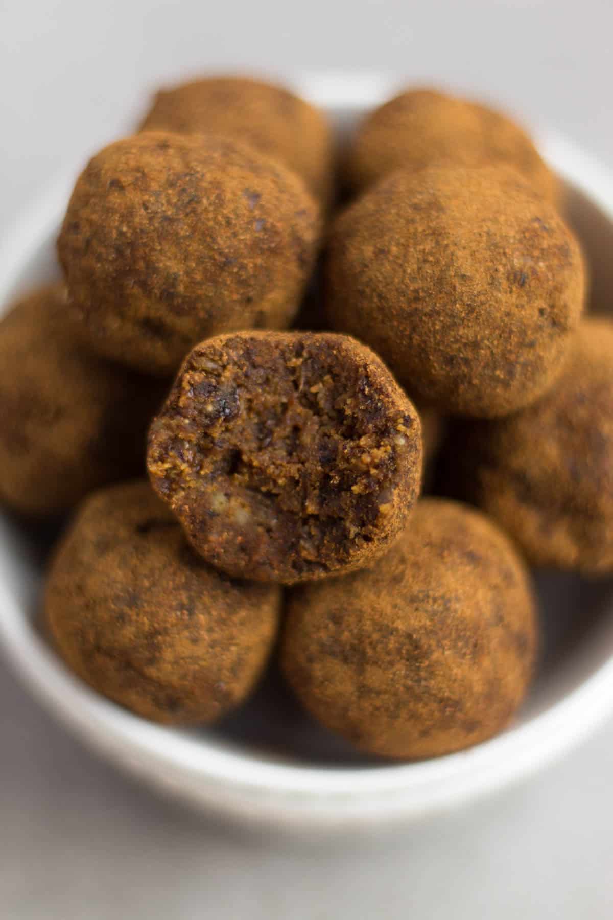 Classic fall flavors make their way into these Pumpkin Cinnamon Raisin Balls for the perfect snack or energy ball pick-me-up. Vegan, paleo, and Whole30 approved! - Eat the Gains