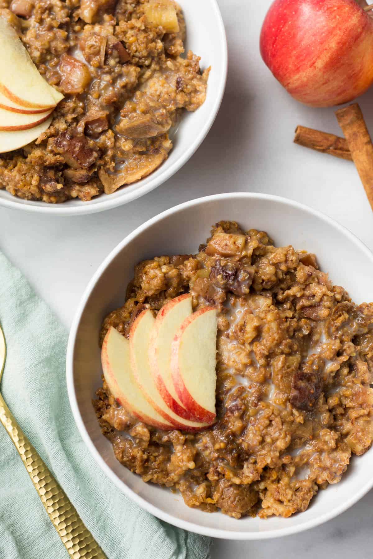 These Fig Apple Cinnamon Slower Cooker Steel Cut Oats combine the flavors of fall to provide a hearty and nutritious breakfast that feels like a treat - Eat the Gains