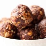 Vegan & gluten free 4 ingredient Peanut Butter & Jelly Energy Balls take your favorite childhood combo & turns it into a healthy & easy on-the-go snack! - Eat the Gains