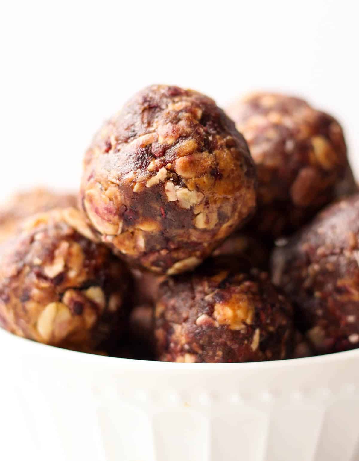 Vegan & gluten free 4 ingredient Peanut Butter & Jelly Energy Balls take your favorite childhood combo & turns it into a healthy & easy on-the-go snack! - Eat the Gains