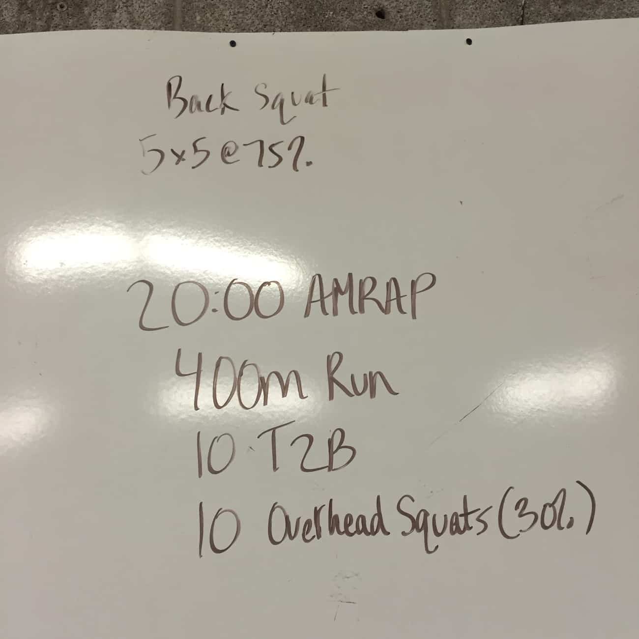 A 20:00 AMRAP of running, toes 2 bar, and overhead squats to work on cardio endurance and your core strength.