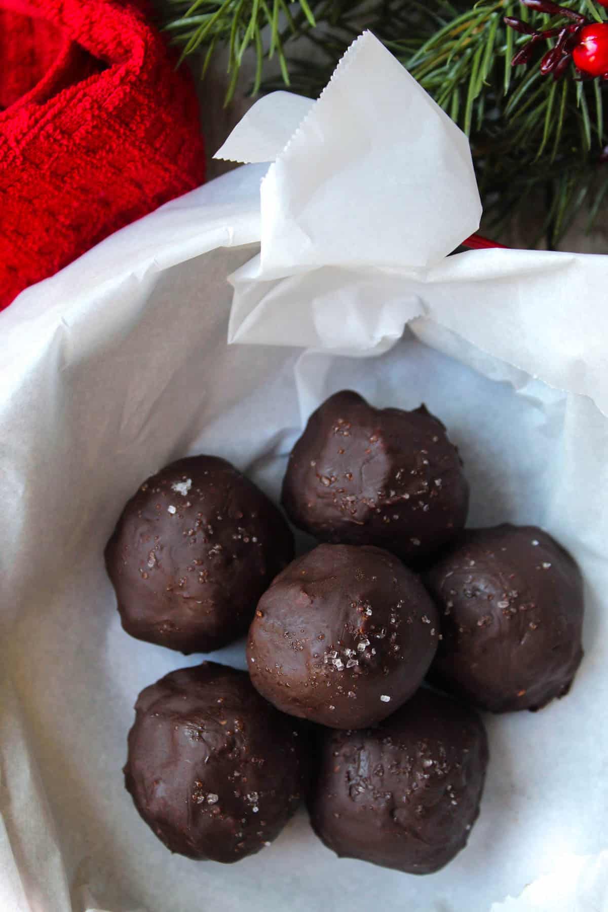 Chocolate Covered Peppermint Macaroons made from only 4 healthy ingredients that taste like a homemade peppermint patty. Vegan, paleo, gluten and dairy free!