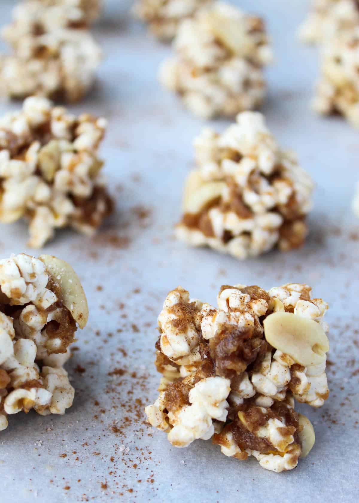 No bake and 30 minutes to make, these Peanut Butter Caramel Popcorn Balls are the perfect holiday snack. No added sweetener, vegan, and gluten free! - Eat the Gains