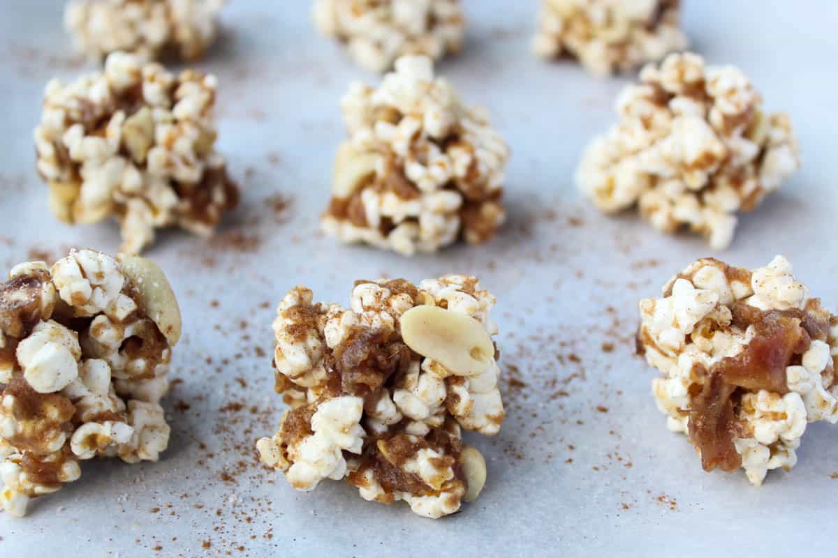 No bake and 30 minutes to make, these Peanut Butter Caramel Popcorn Balls are the perfect holiday snack. No added sweetener, vegan, and gluten free! - Eat the Gains