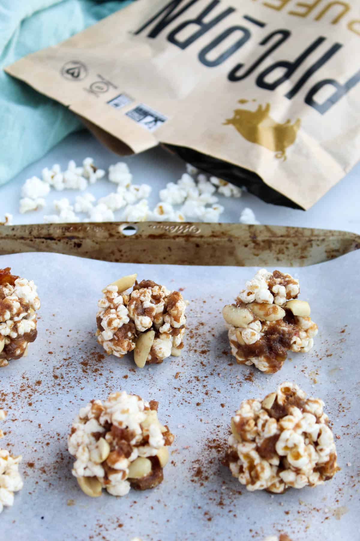 No bake and 30 minutes to make, these Peanut Butter Caramel Popcorn Balls are the perfect holiday snack. No added sweetener, vegan, and gluten free! - Eat the Gains