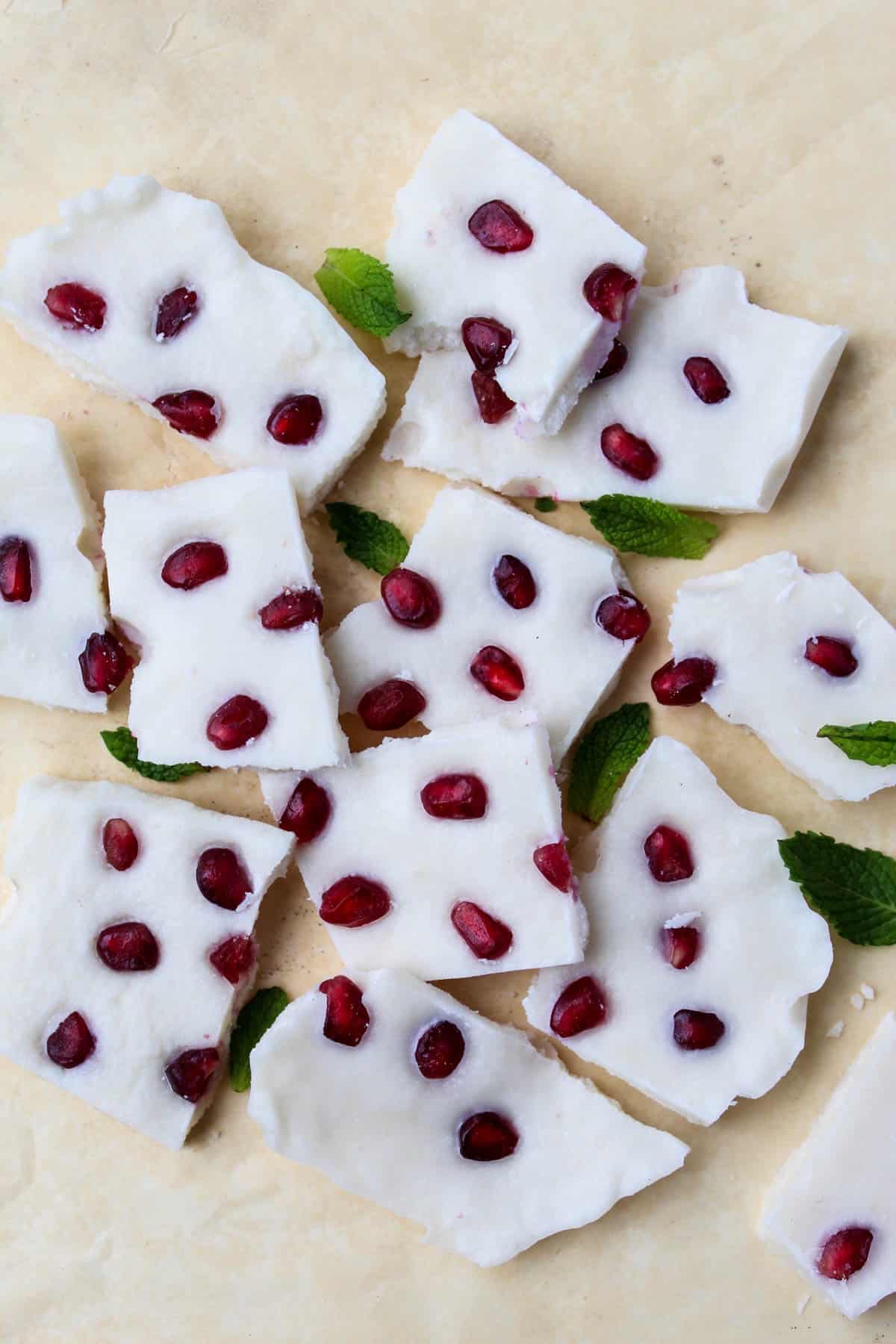 Four ingredients make this paleo & vegan Pomegranate Peppermint Coconut Bark, a perfect healthy treat for the holidays or a great homemade gift to give - Eat the Gains