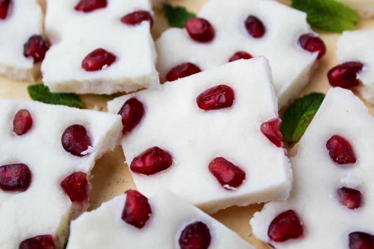 Four ingredients make this paleo & vegan Pomegranate Peppermint Coconut Bark, a perfect healthy treat for the holidays or a great homemade gift to give - Eat the Gains