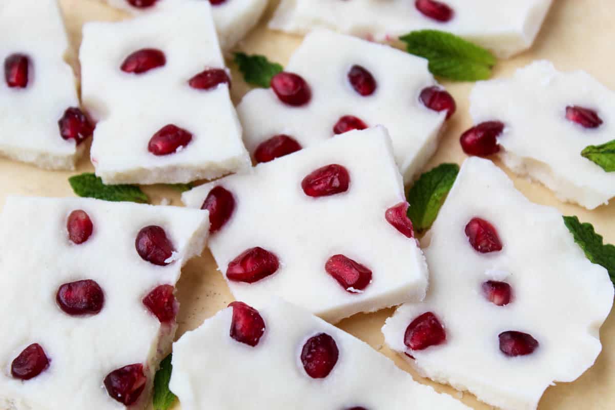 Four ingredients make this paleo & vegan Pomegranate Peppermint Coconut Bark, a perfect healthy treat for the holidays or a great homemade gift to give - Eat the Gains