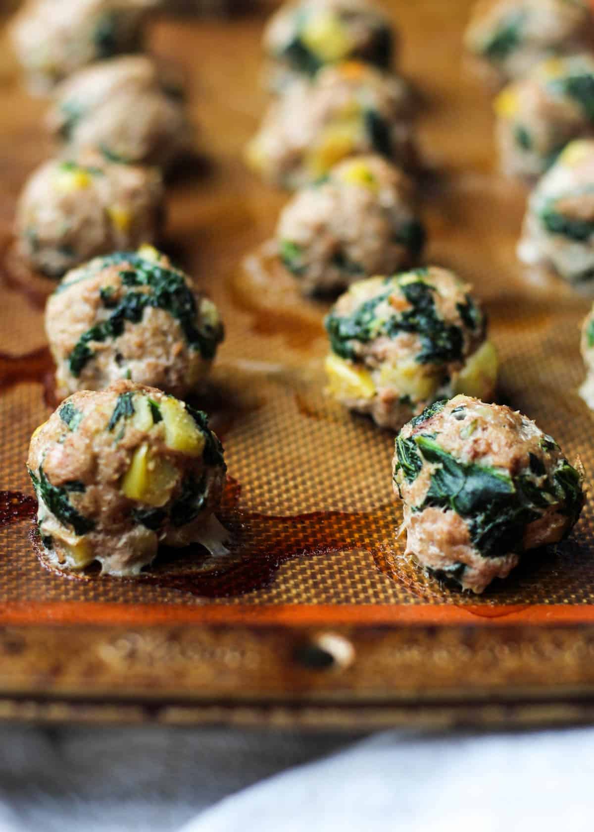 Protein, veggies, and fruit packed, these Turkey, Kale, & Apple Meatballs come together in less than 30 minutes and are paleo, gluten free, and Whole30 compliant! - Eat the Gains