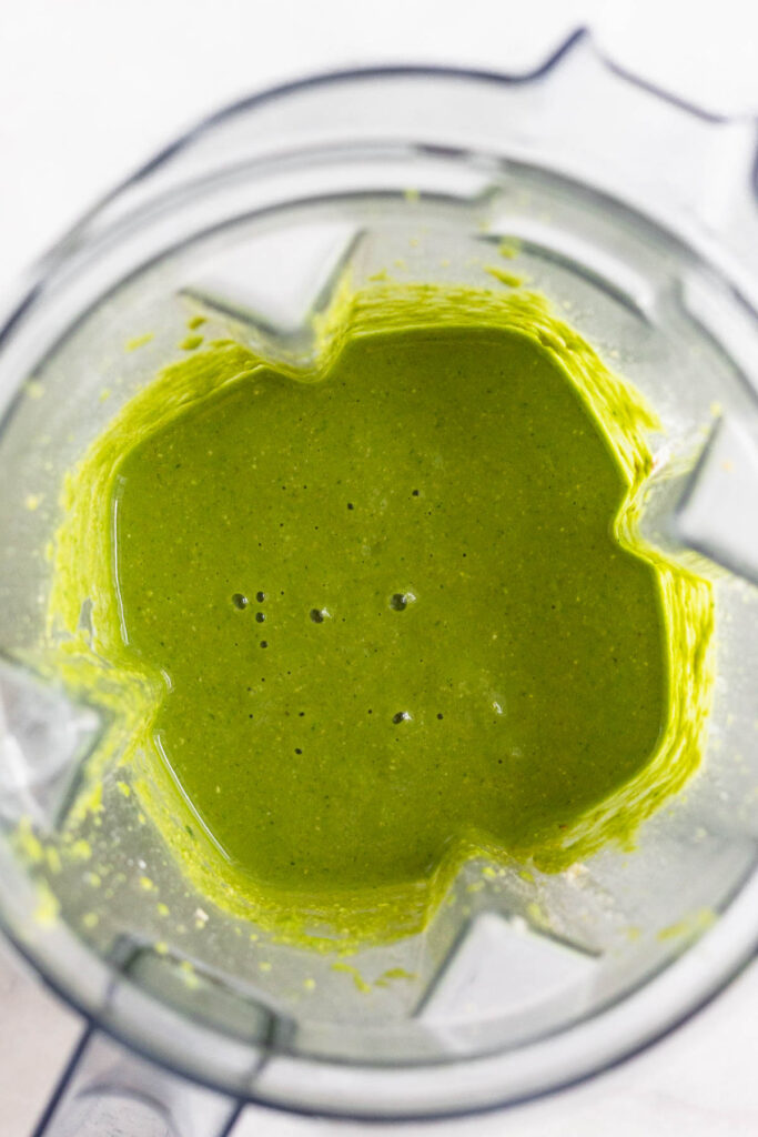 Green batter in a blender.