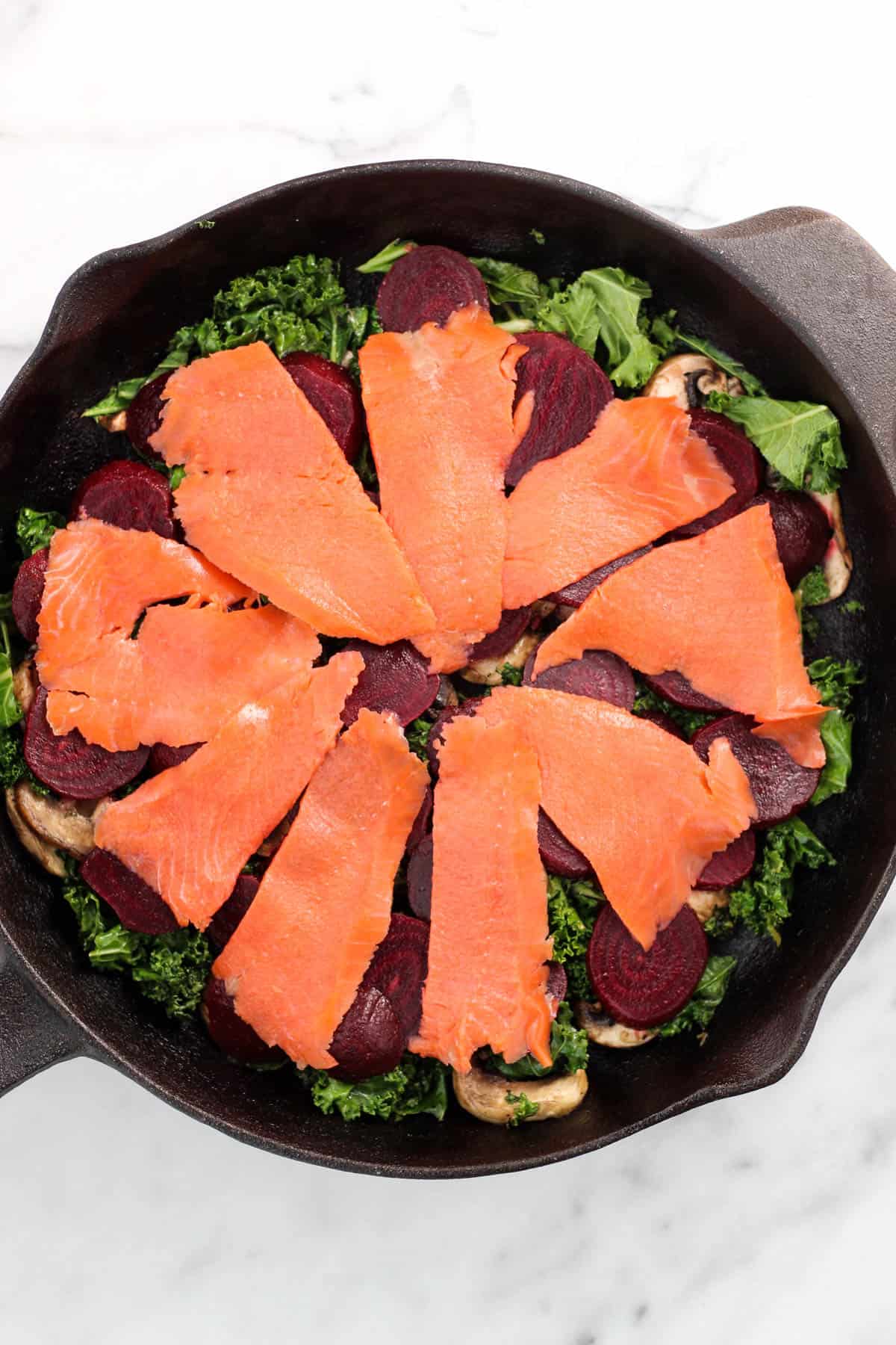 An easy and nutrient packed breakfast, this Beet & Smoked Salmon Frittata calls for one pan, less than 30 minutes, and is paleo, Whole30, and dairy free! - Eat the Gains