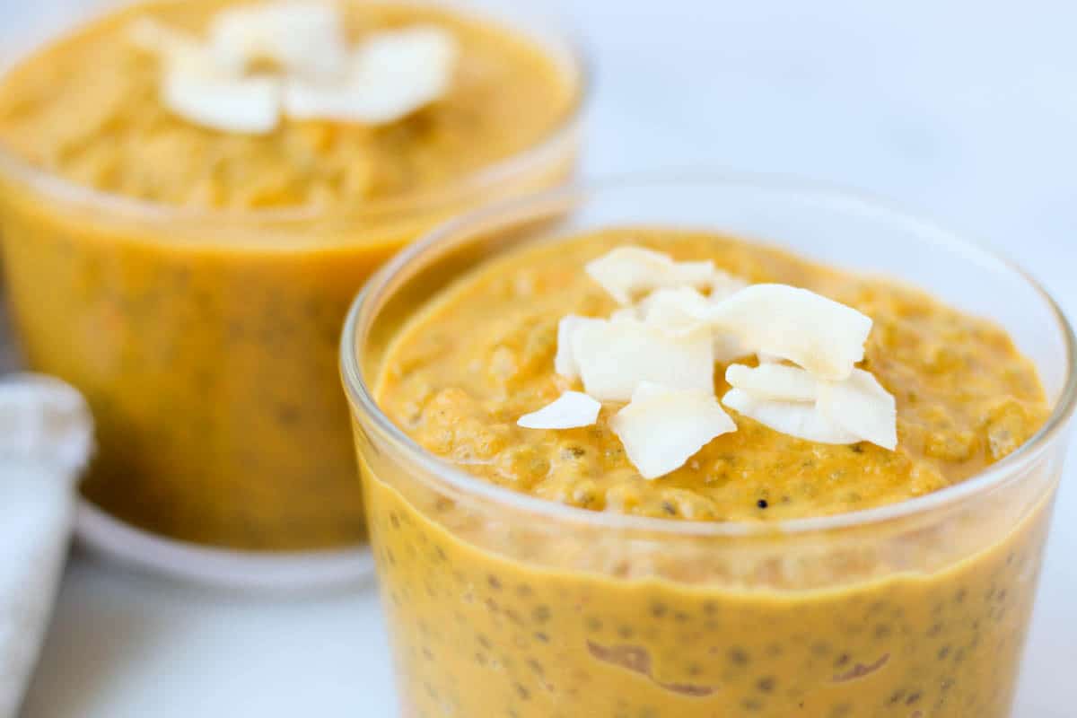 This Carrot Cake Chia Pudding takes the flavors of a classic dessert and turns it into a healthy snack that is paleo, vegan, and dairy & gluten free - Eat the Gains