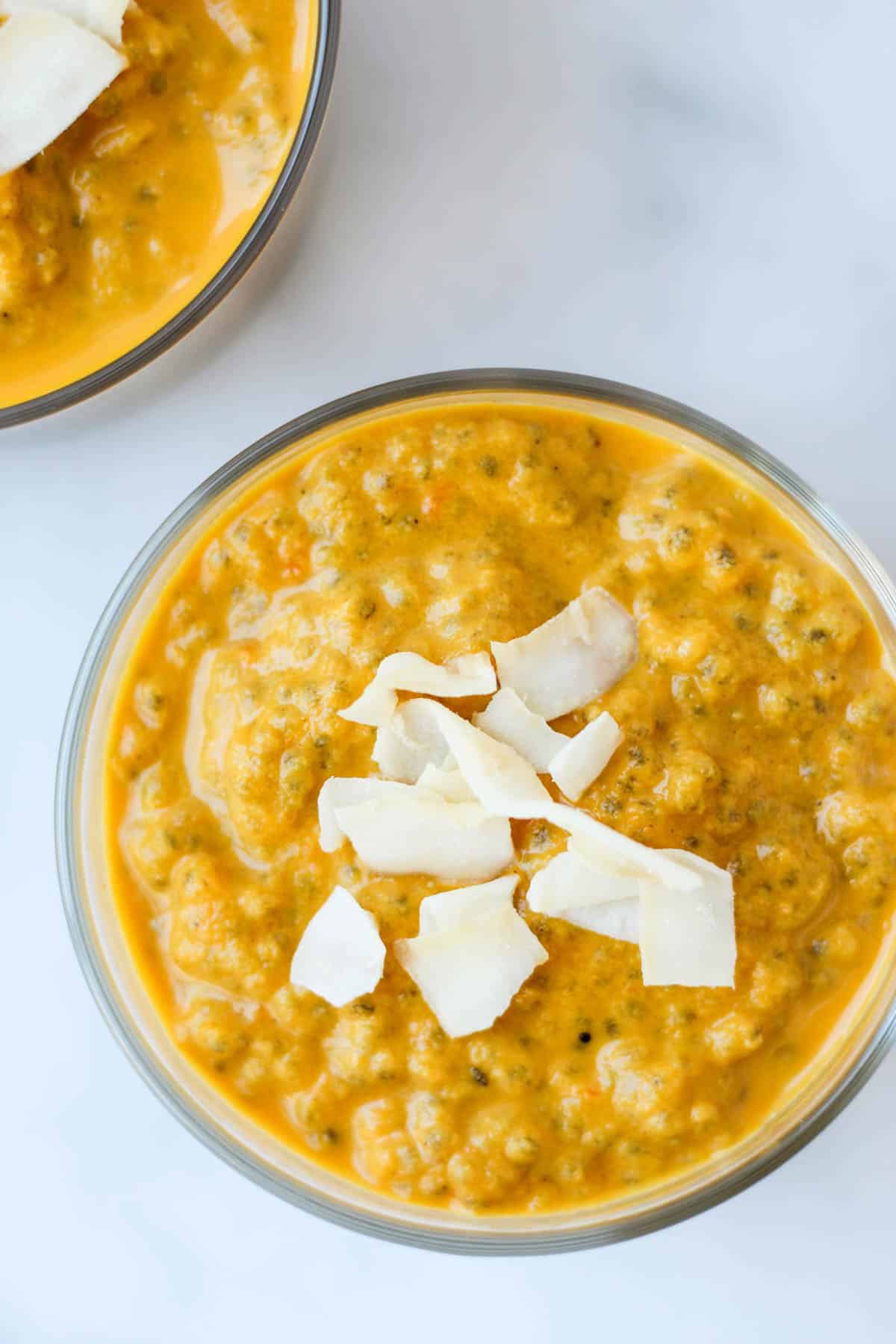 This Carrot Cake Chia Pudding takes the flavors of a classic dessert and turns it into a healthy snack that is paleo, vegan, and dairy & gluten free - Eat the Gains