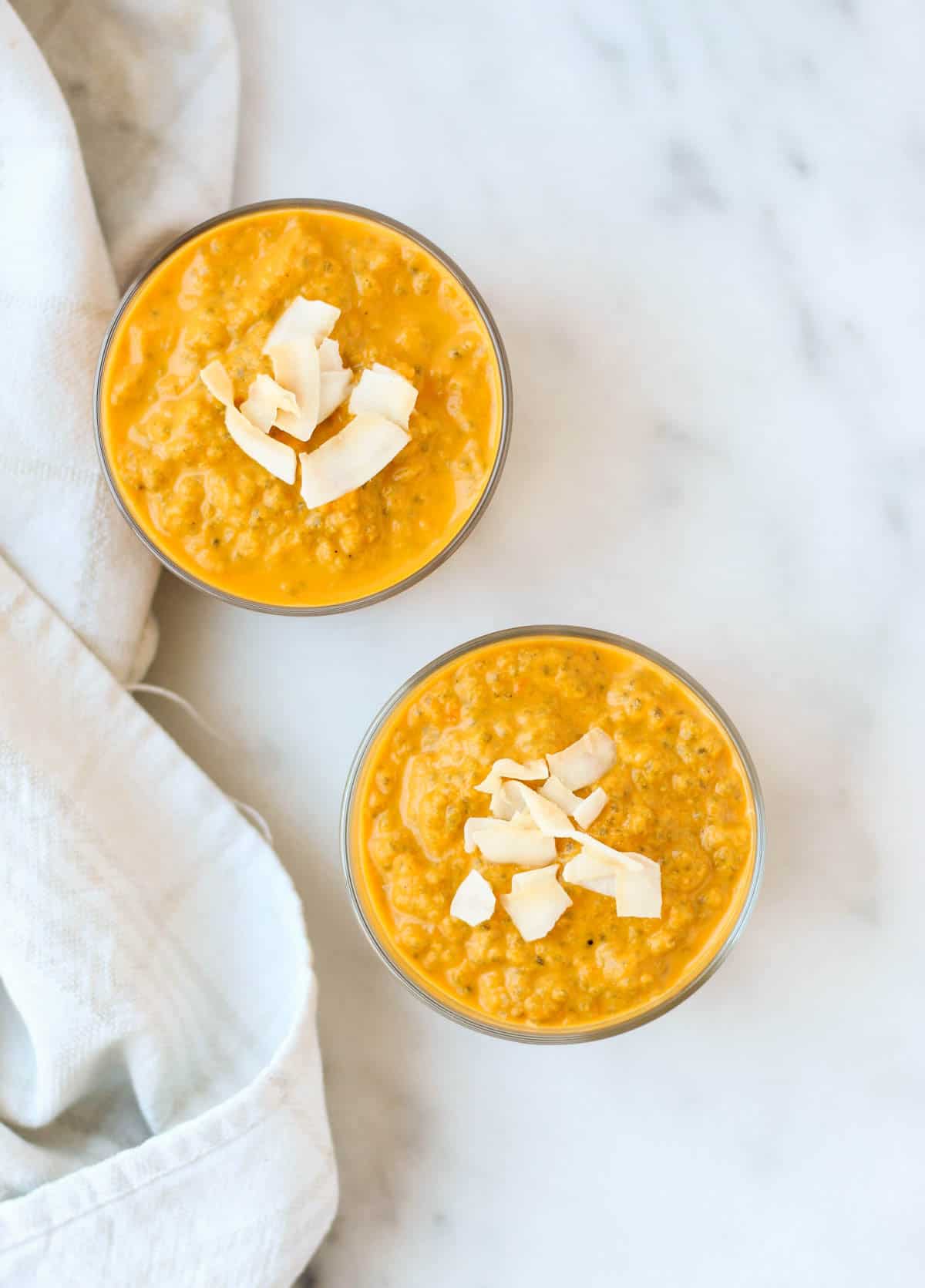 This Carrot Cake Chia Pudding takes the flavors of a classic dessert and turns it into a healthy snack that is paleo, vegan, and dairy & gluten free - Eat the Gains