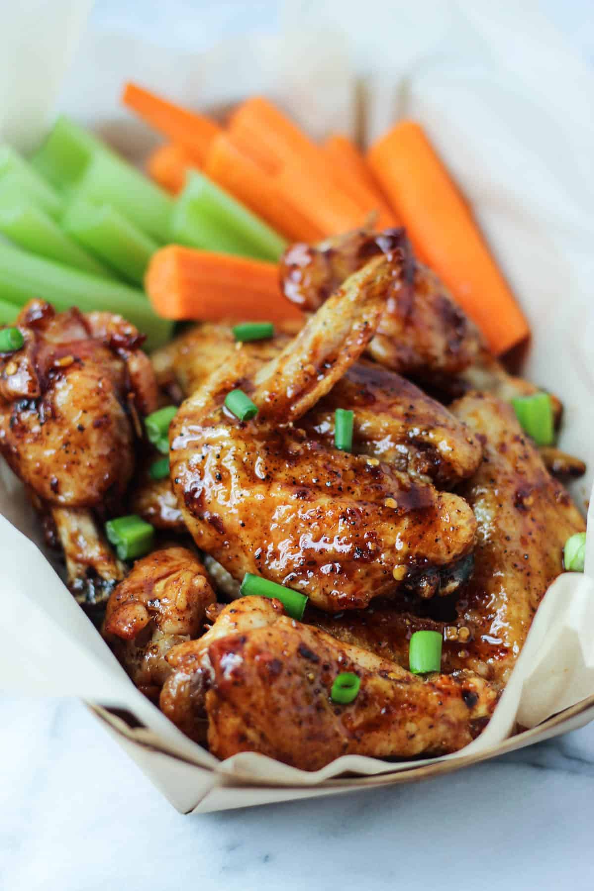These paleo baked wings combine the perfect balance of sweet & spicy with a little kick from cold brew coffee. Made from good for you ingredients, they are paleo, gluten free, & dairy free - Eat the Gains