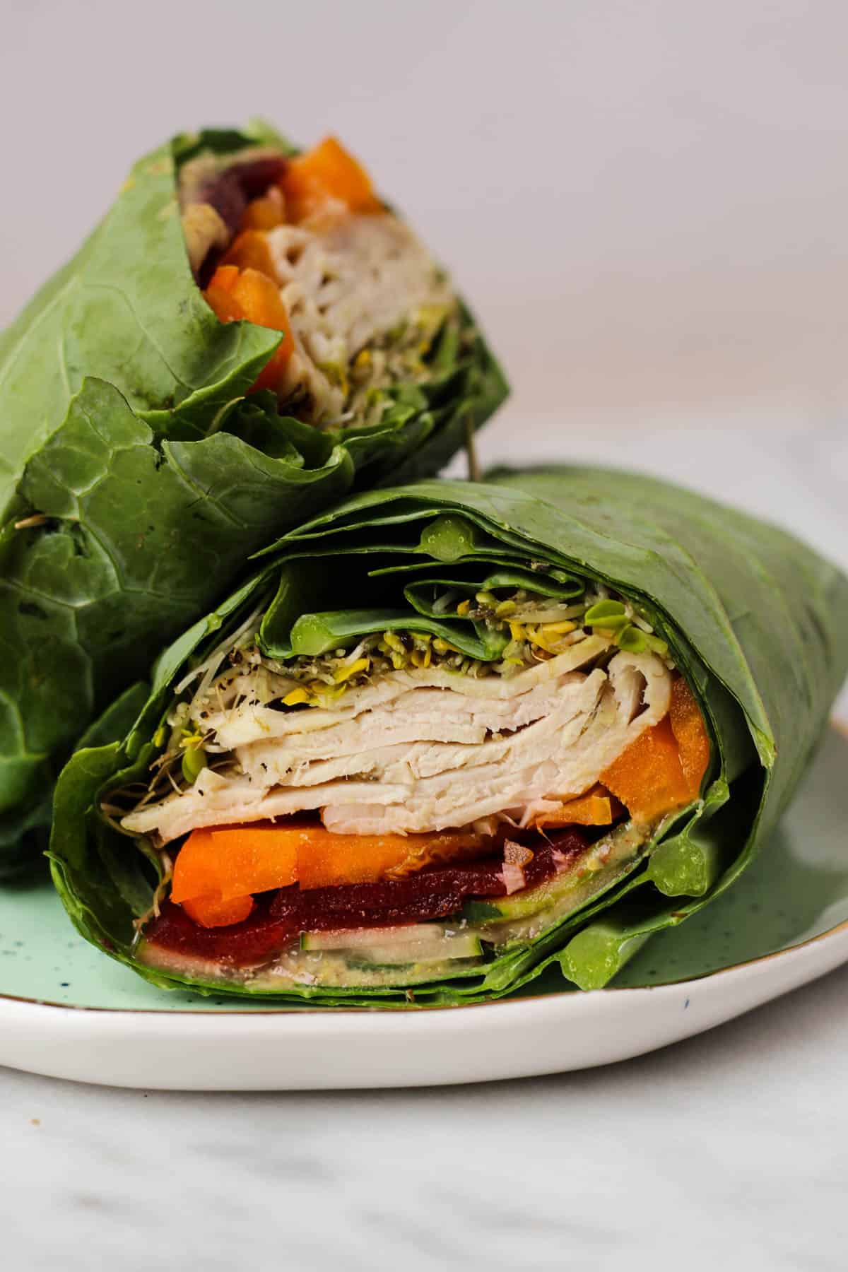 Use collard greens as a low carb and nutrient packed wrap! These Turkey Collard Wraps are customizable to your liking and paleo and Whole30 approved! - Eat the Gains