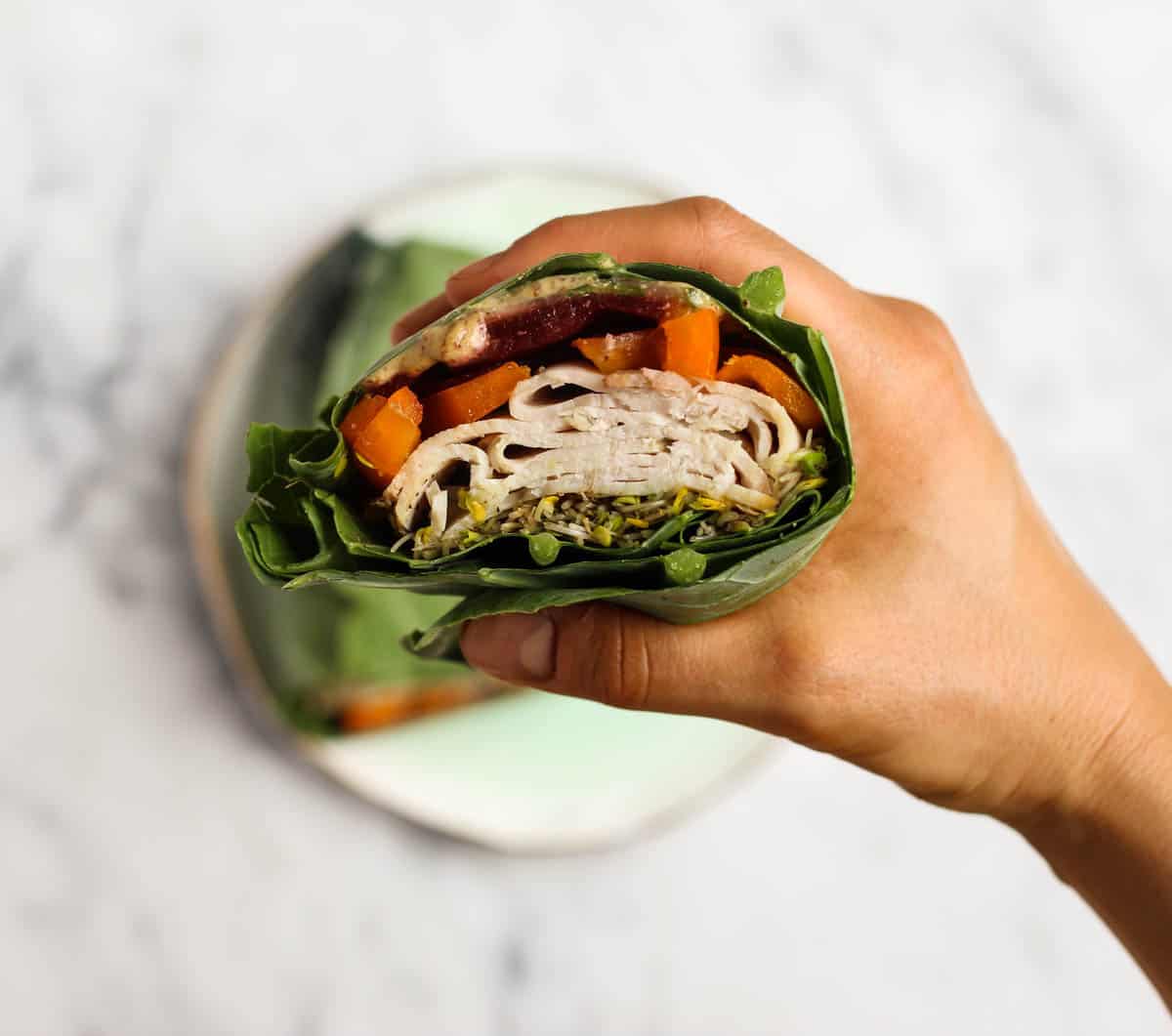 Use collard greens as a low carb and nutrient packed wrap! These Turkey Collard Wraps are customizable to your liking and paleo and Whole30 approved! - Eat the Gains