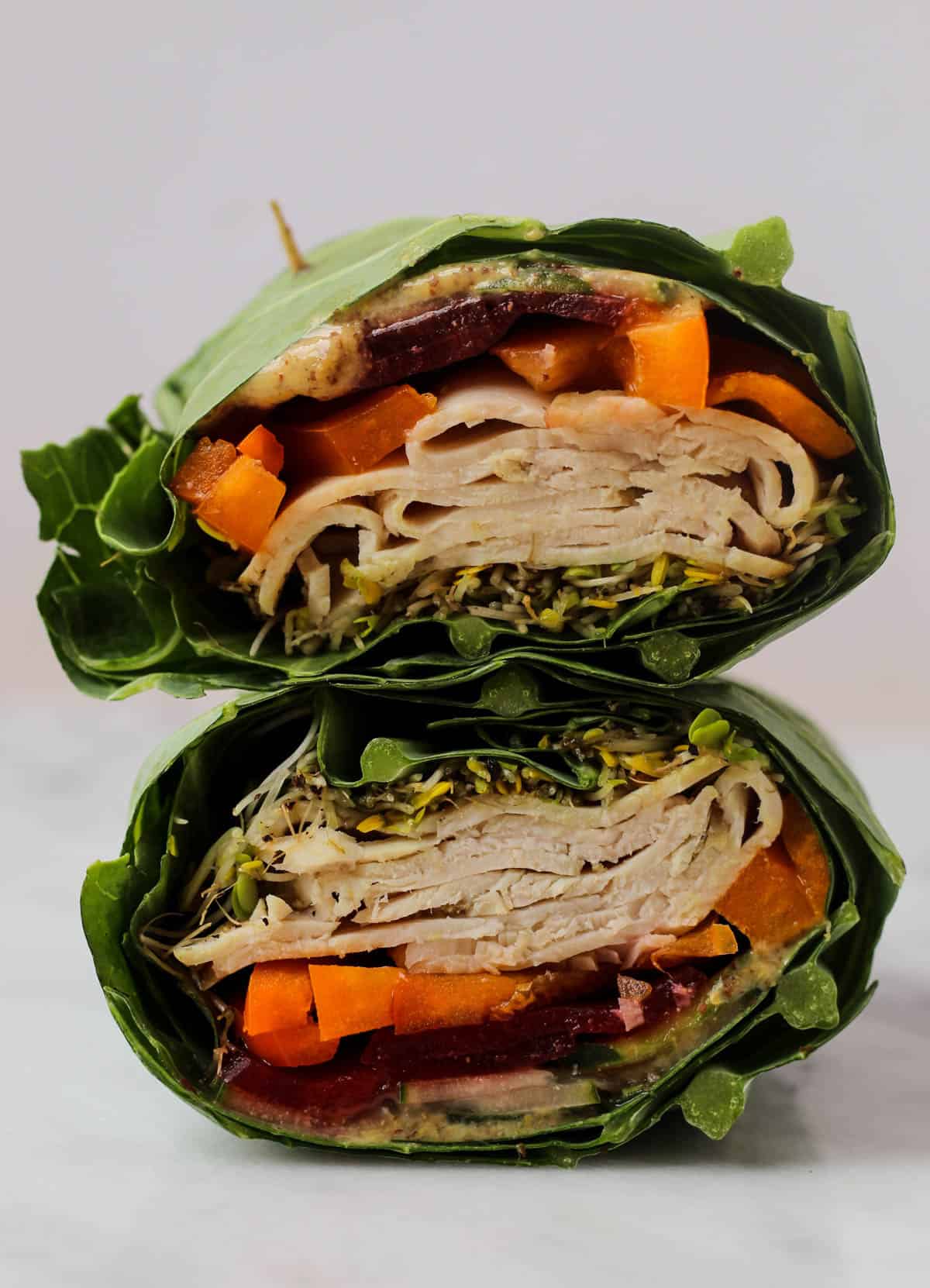 Use collard greens as a low carb and nutrient packed wrap! These Turkey Collard Wraps are customizable to your liking and paleo and Whole30 approved! - Eat the Gains