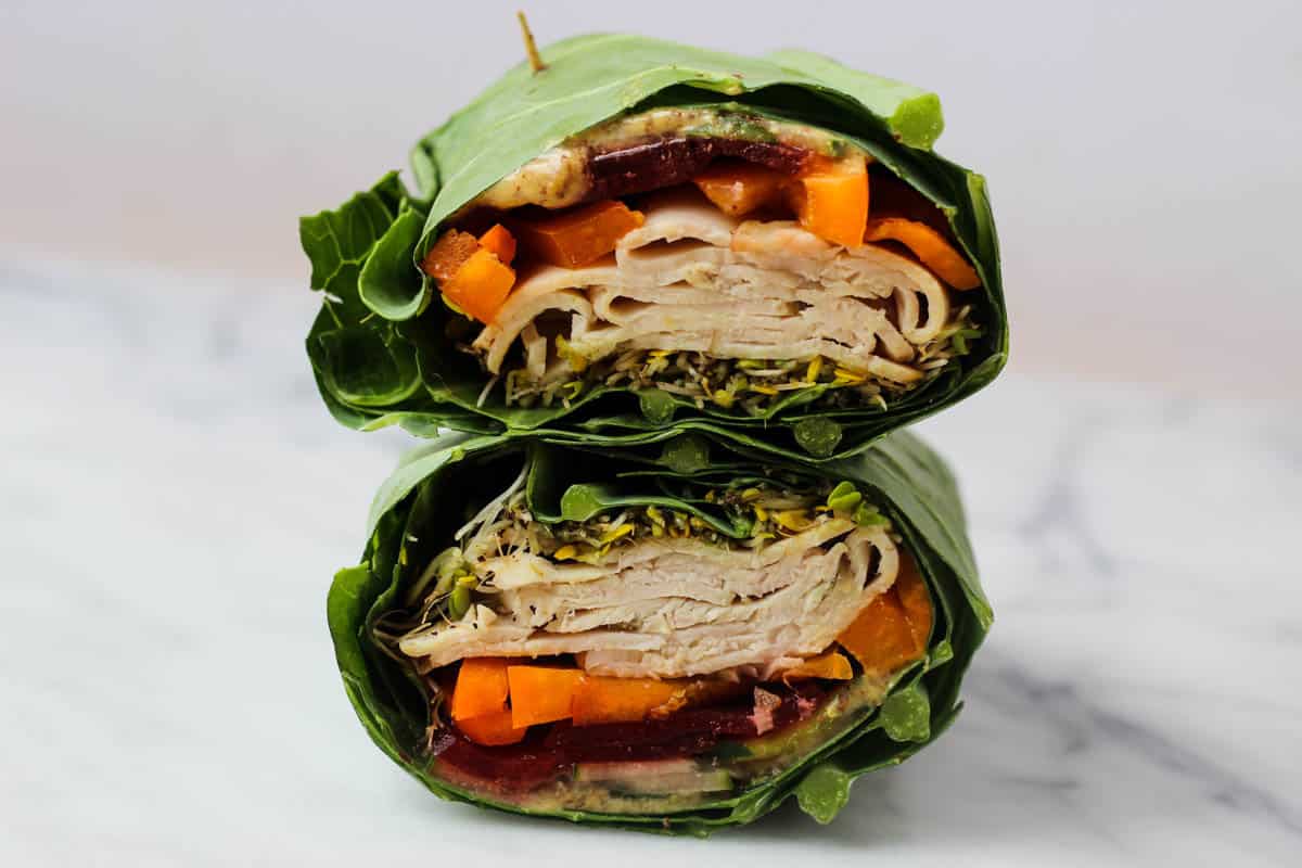 Use collard greens as a low carb and nutrient packed wrap! These Turkey Collard Wraps are customizable to your liking and paleo and Whole30 approved! - Eat the Gains