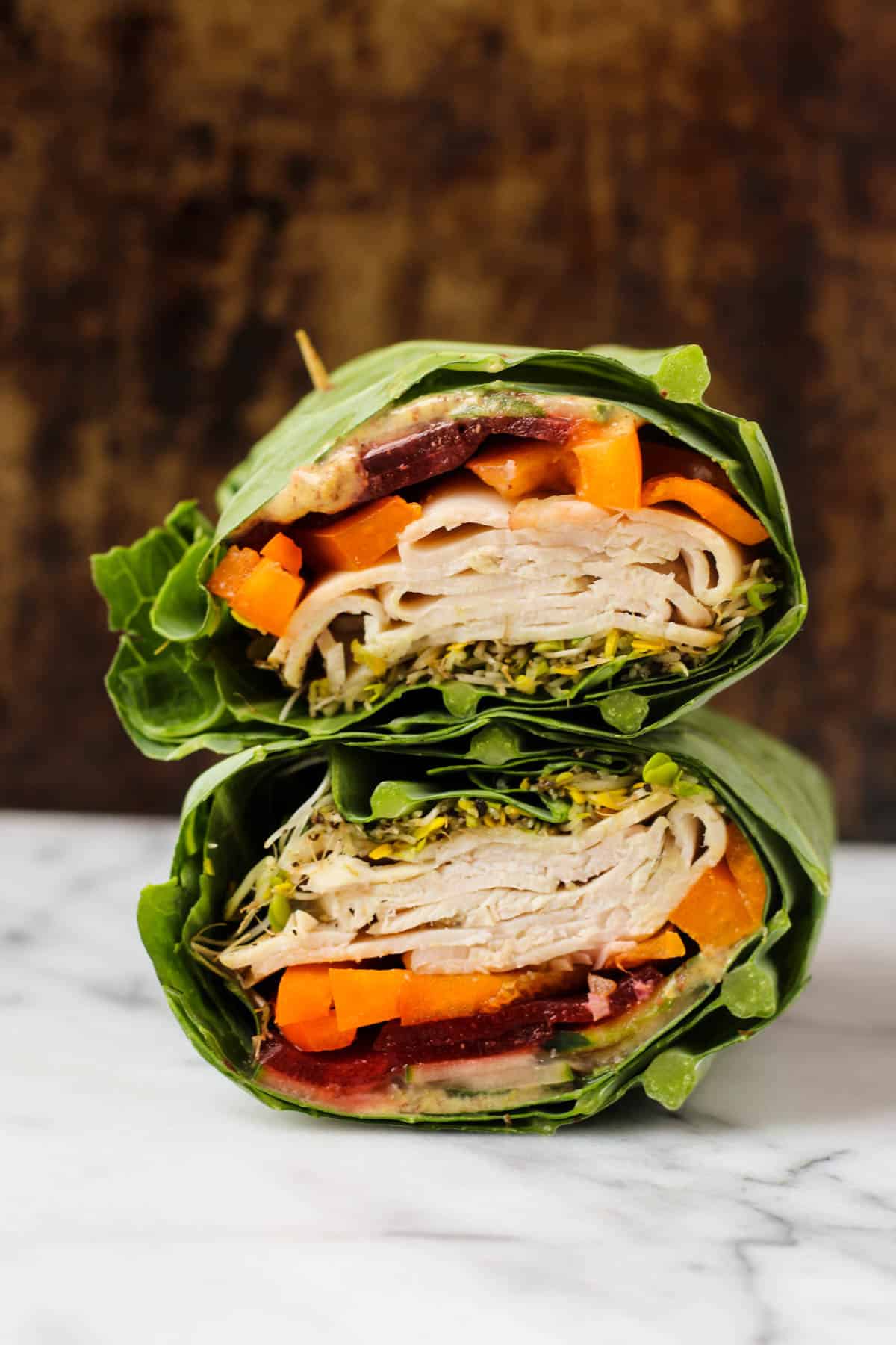 Use collard greens as a low carb and nutrient packed wrap! These Turkey Collard Wraps are customizable to your liking and paleo and Whole30 approved! - Eat the Gains