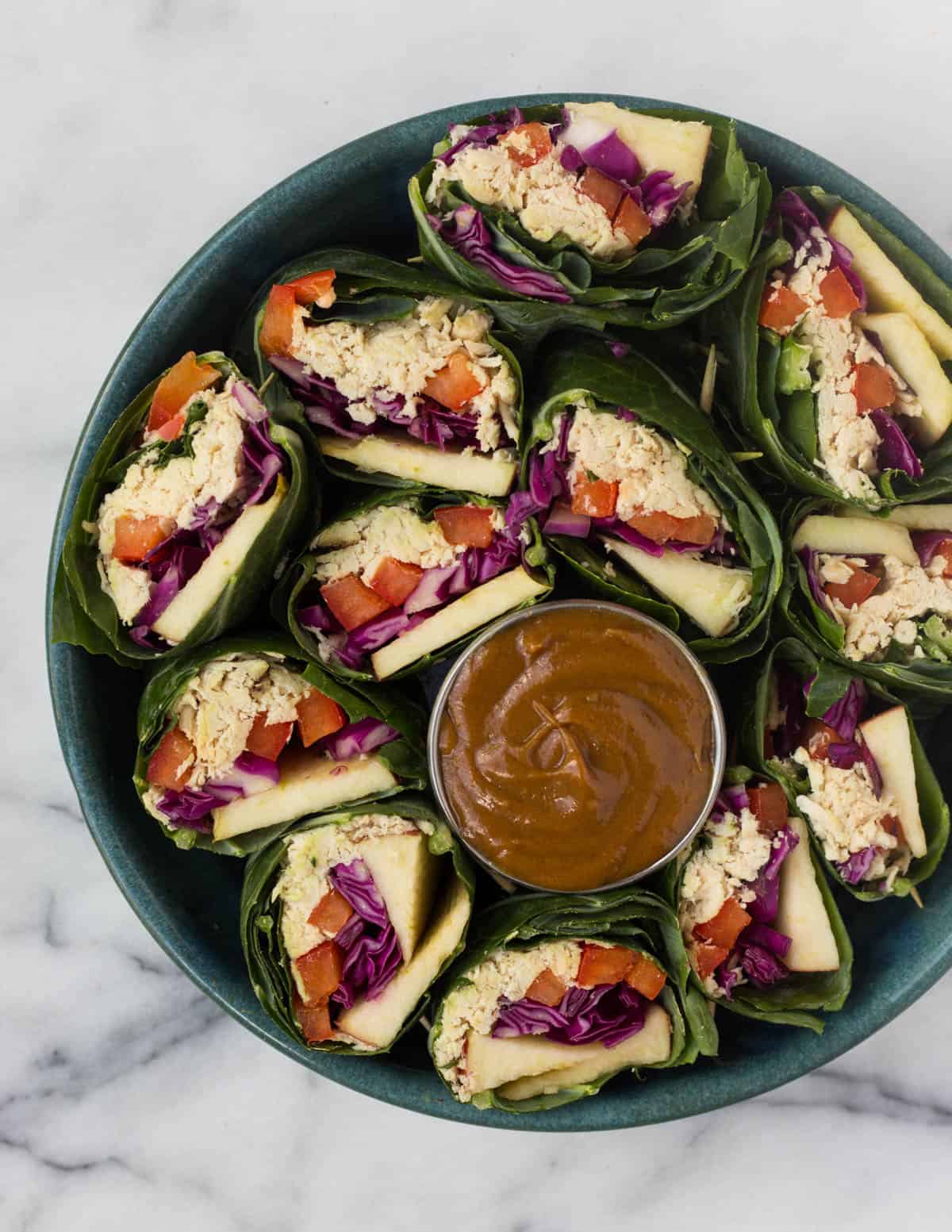 A fun and healthy red, white, & blue veggie packed dish, these Party Sized Chicken Collard Wraps with Peanut Sauce make the perfect appetizer for a BBQ or party! - Eat the Gains