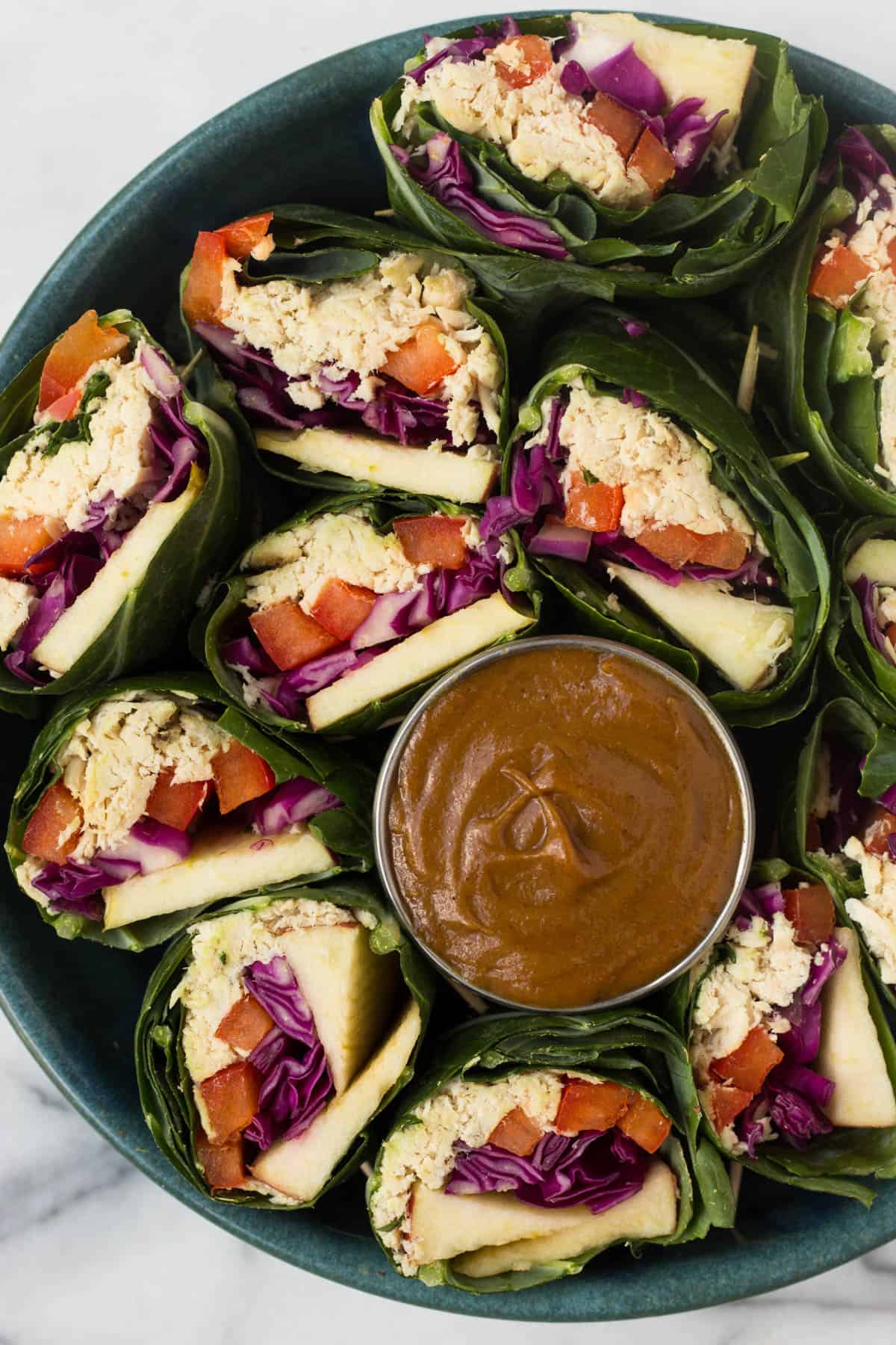 A fun and healthy red, white, & blue veggie packed dish, these Party Sized Chicken Collard Wraps with Peanut Sauce make the perfect appetizer for a BBQ or party! - Eat the Gains