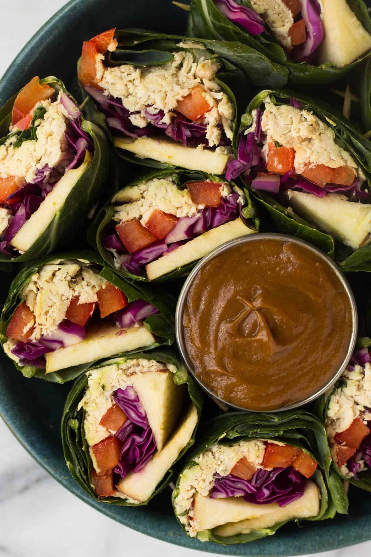 A fun and healthy red, white, & blue veggie packed dish, these Party Sized Chicken Collard Wraps with Peanut Sauce make the perfect appetizer for a BBQ or party! - Eat the Gains