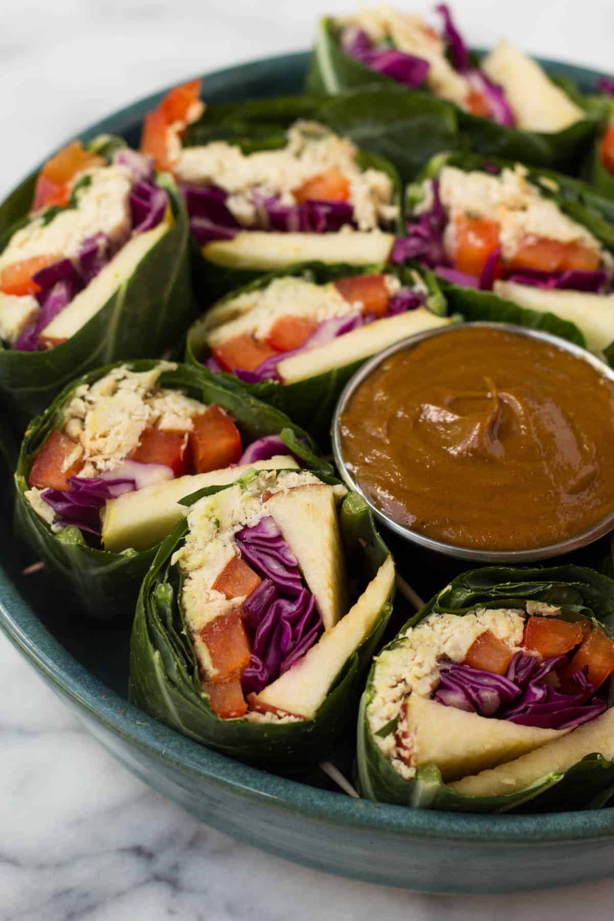 A fun and healthy red, white, & blue veggie packed dish, these Party Sized Chicken Collard Wraps with Peanut Sauce make the perfect appetizer for a BBQ or party! - Eat the Gains