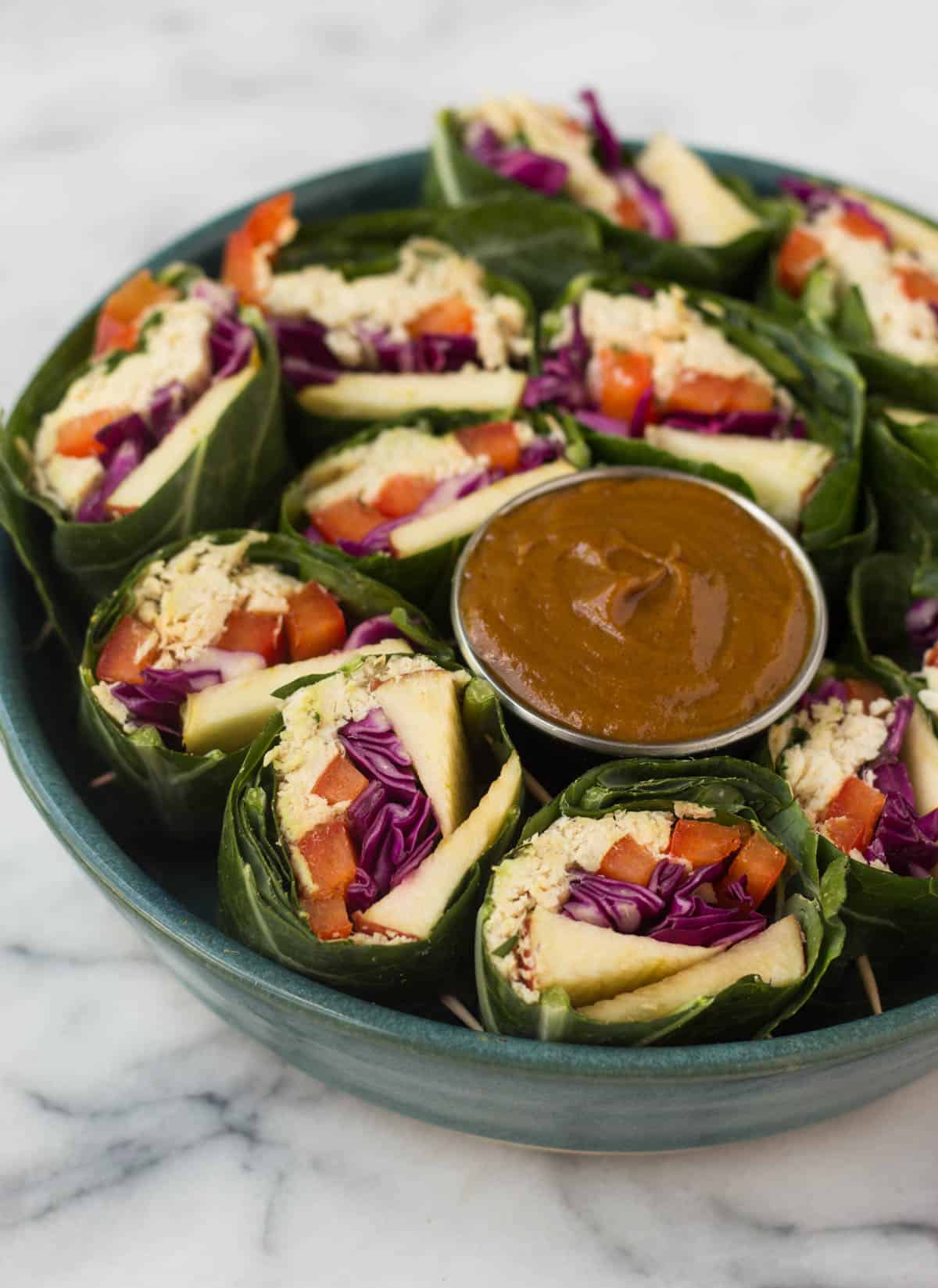 A fun and healthy red, white, & blue veggie packed dish, these Party Sized Chicken Collard Wraps with Peanut Sauce make the perfect appetizer for a BBQ or party! - Eat the Gains