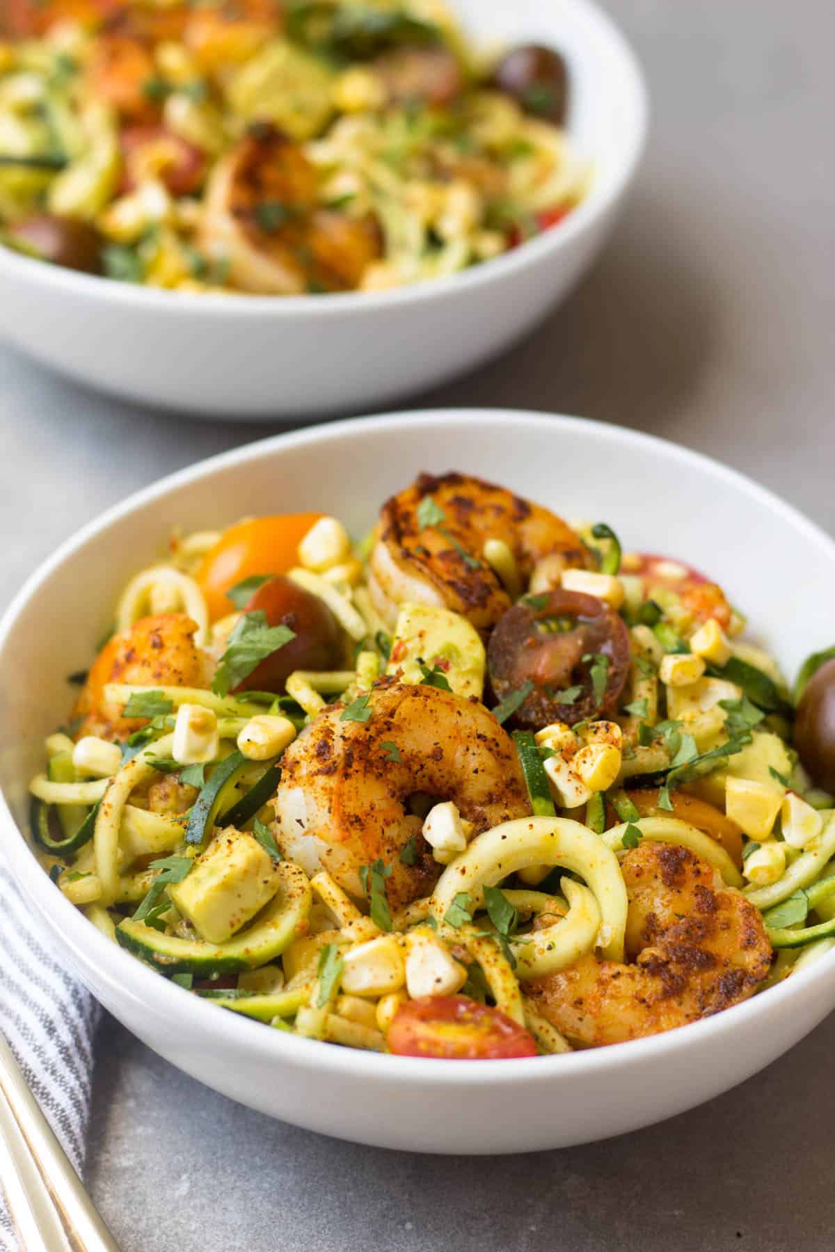 These Southwest Shrimp Zucchini Noodles are an easy and light summer dish packed with protein and seasonal vegetables. - Eat the Gains