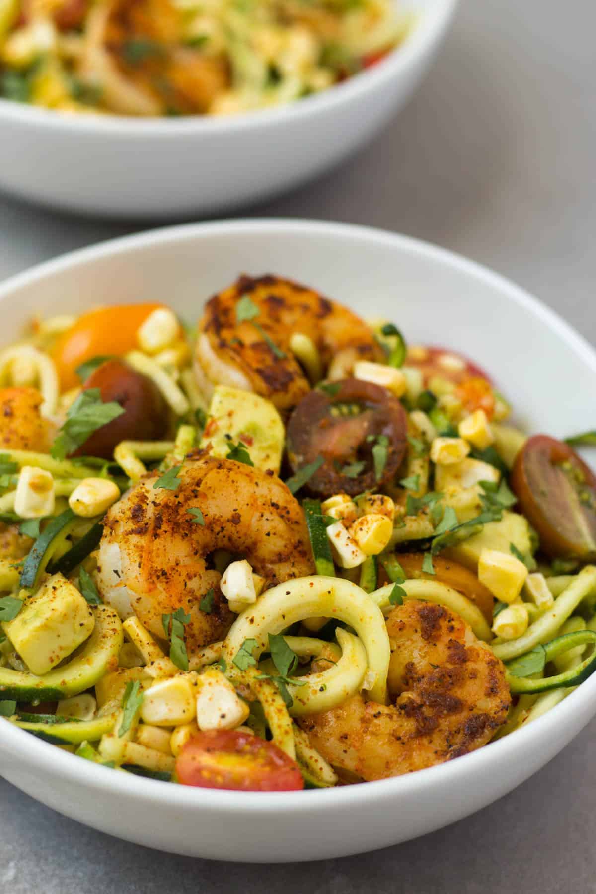 These Southwest Shrimp Zucchini Noodles are an easy and light summer dish packed with protein and seasonal vegetables. - Eat the Gains