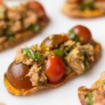 A paleo and Whole30 approved protein packed, this Tuna Bruschetta on Sweet Potato Toast makes easy, healthy, and crowd pleasing appetizer or snack! - Eat the Gains