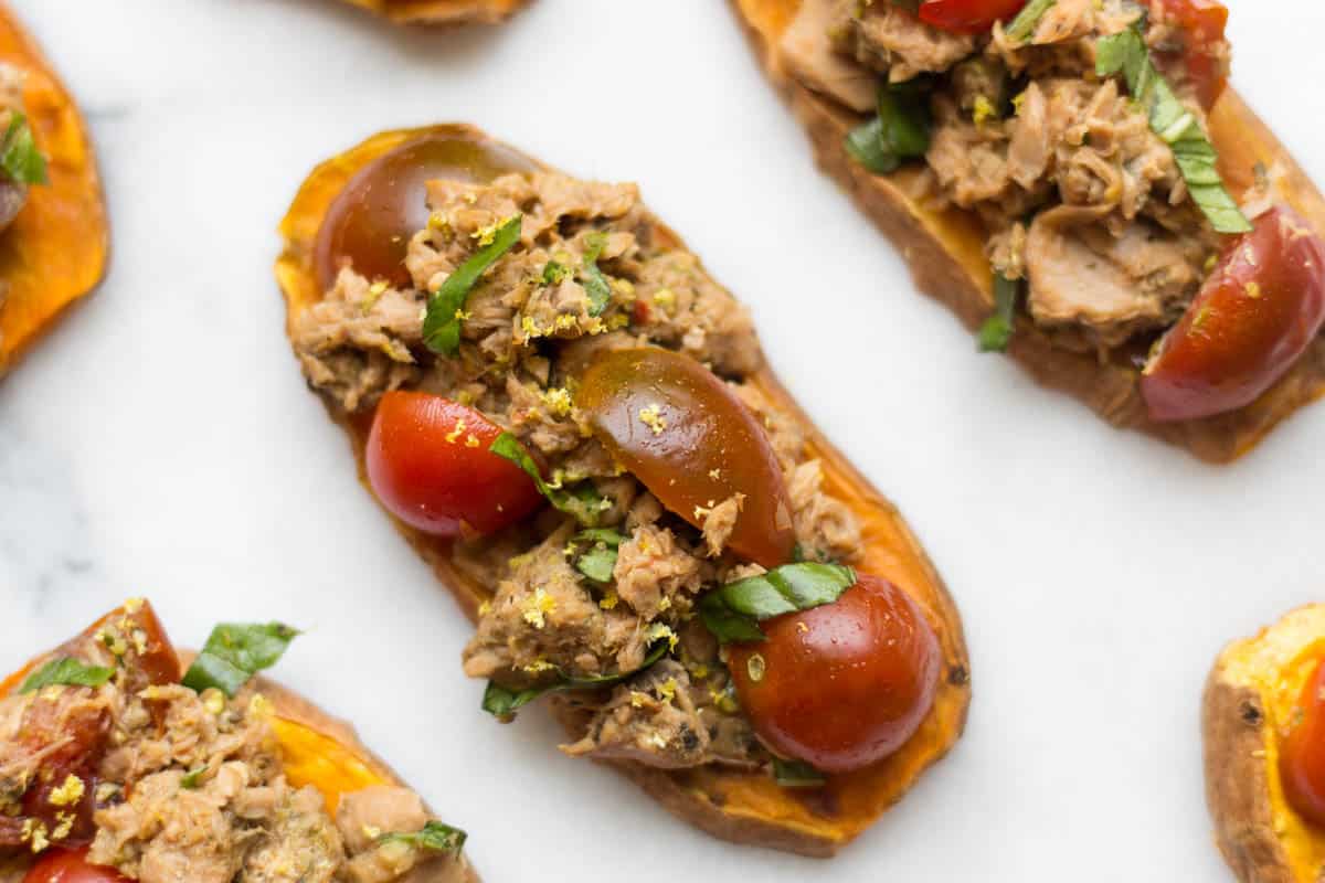 A paleo and Whole30 approved protein packed, this Tuna Bruschetta on Sweet Potato Toast makes easy, healthy, and crowd pleasing appetizer or snack! - Eat the Gains