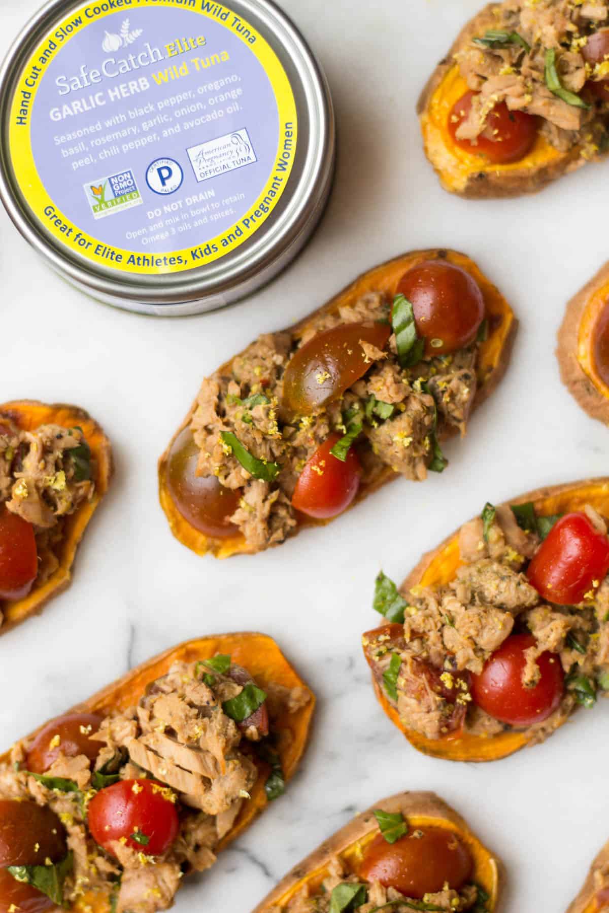 A paleo and Whole30 approved protein packed, this Tuna Bruschetta on Sweet Potato Toast makes easy, healthy, and crowd pleasing appetizer or snack! - Eat the Gains
