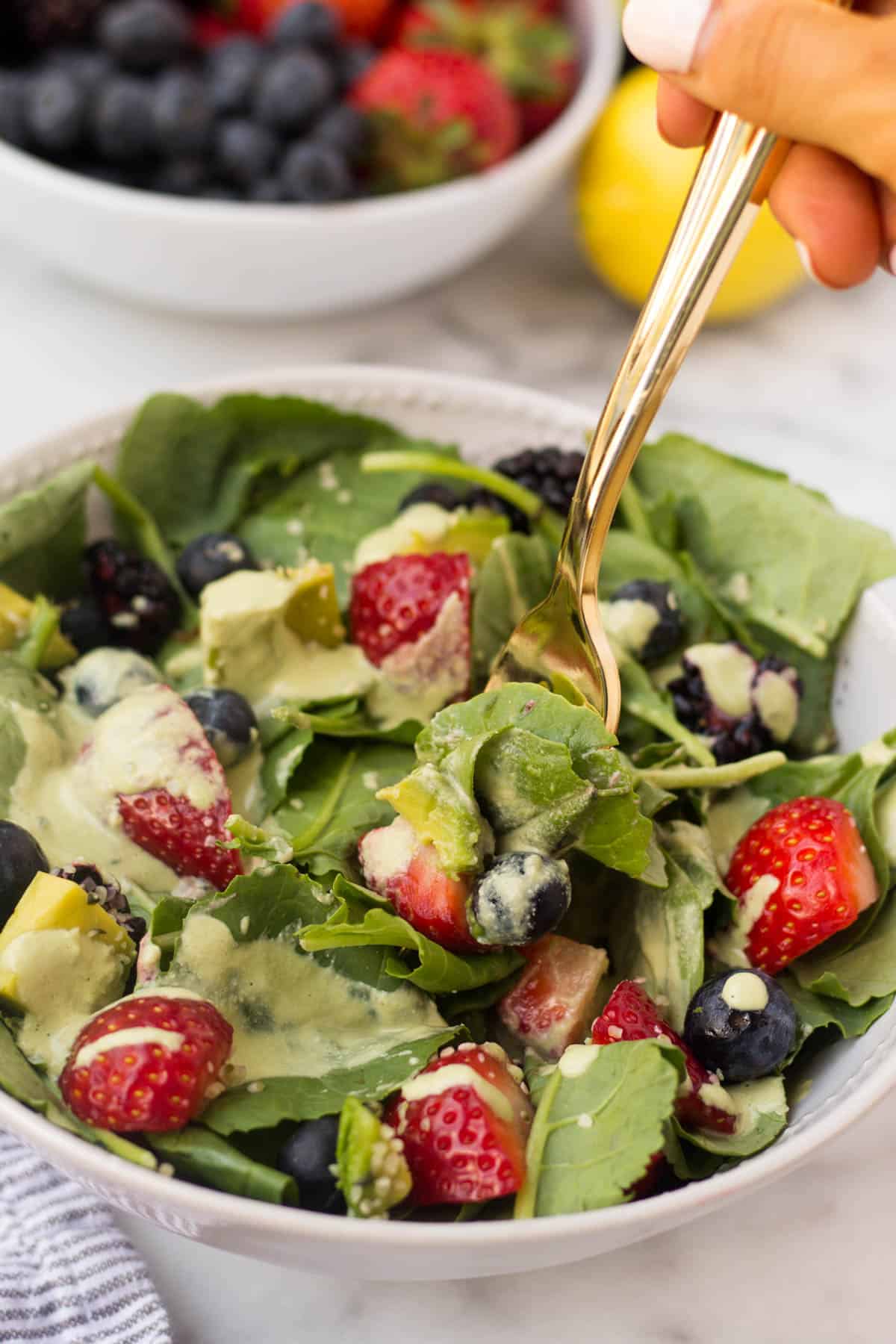 A perfect easy & light end of summer dish, this Berry Avocado Salad with Creamy Matcha Dressing packs the nutrients & is paleo, vegan, dairy free, & Whole30 approved! - Eat the Gains
