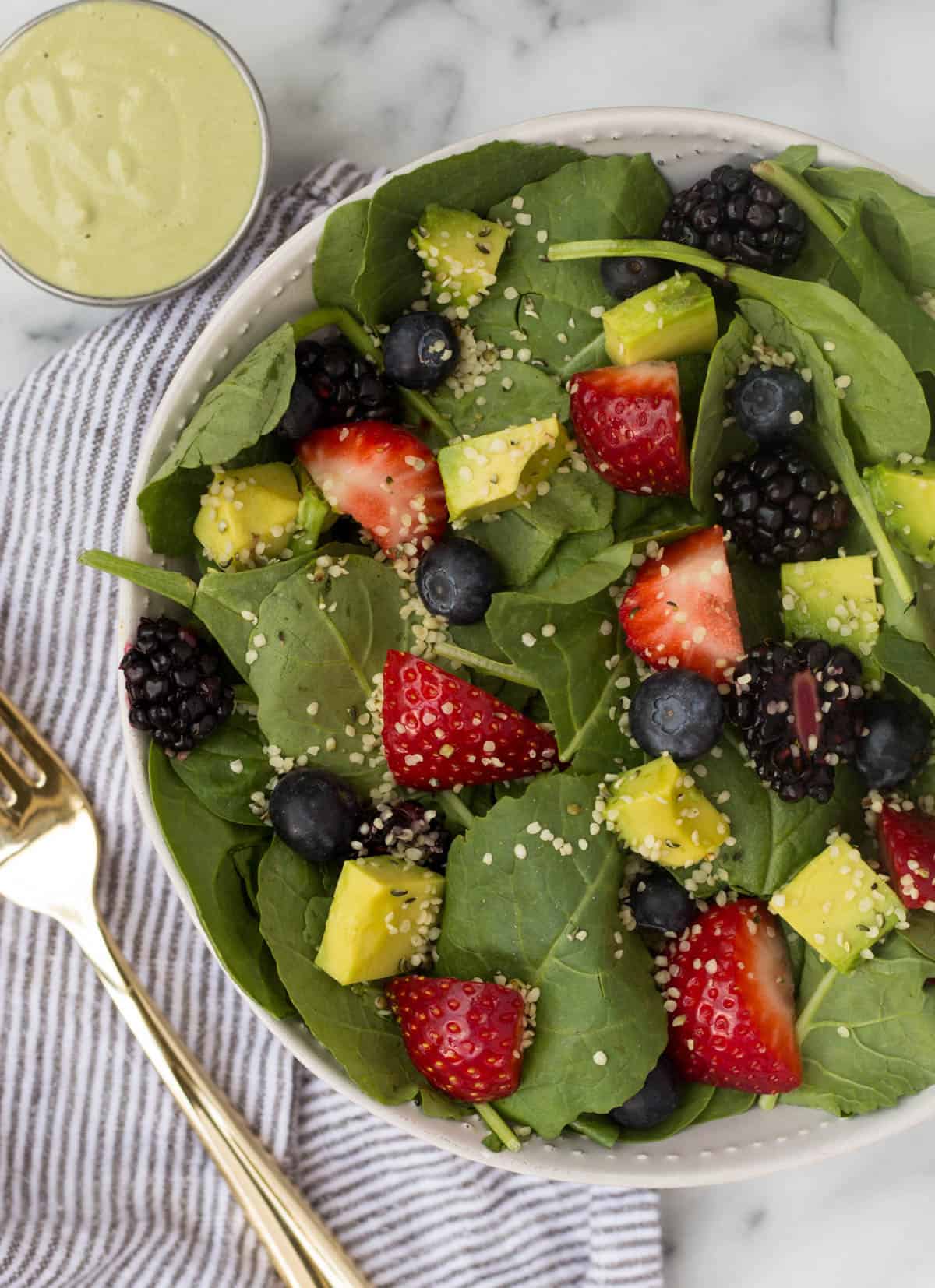 A perfect easy & light end of summer dish, this Berry Avocado Salad with Creamy Matcha Dressing packs the nutrients & is paleo, vegan, dairy free, & Whole30 approved! - Eat the Gains