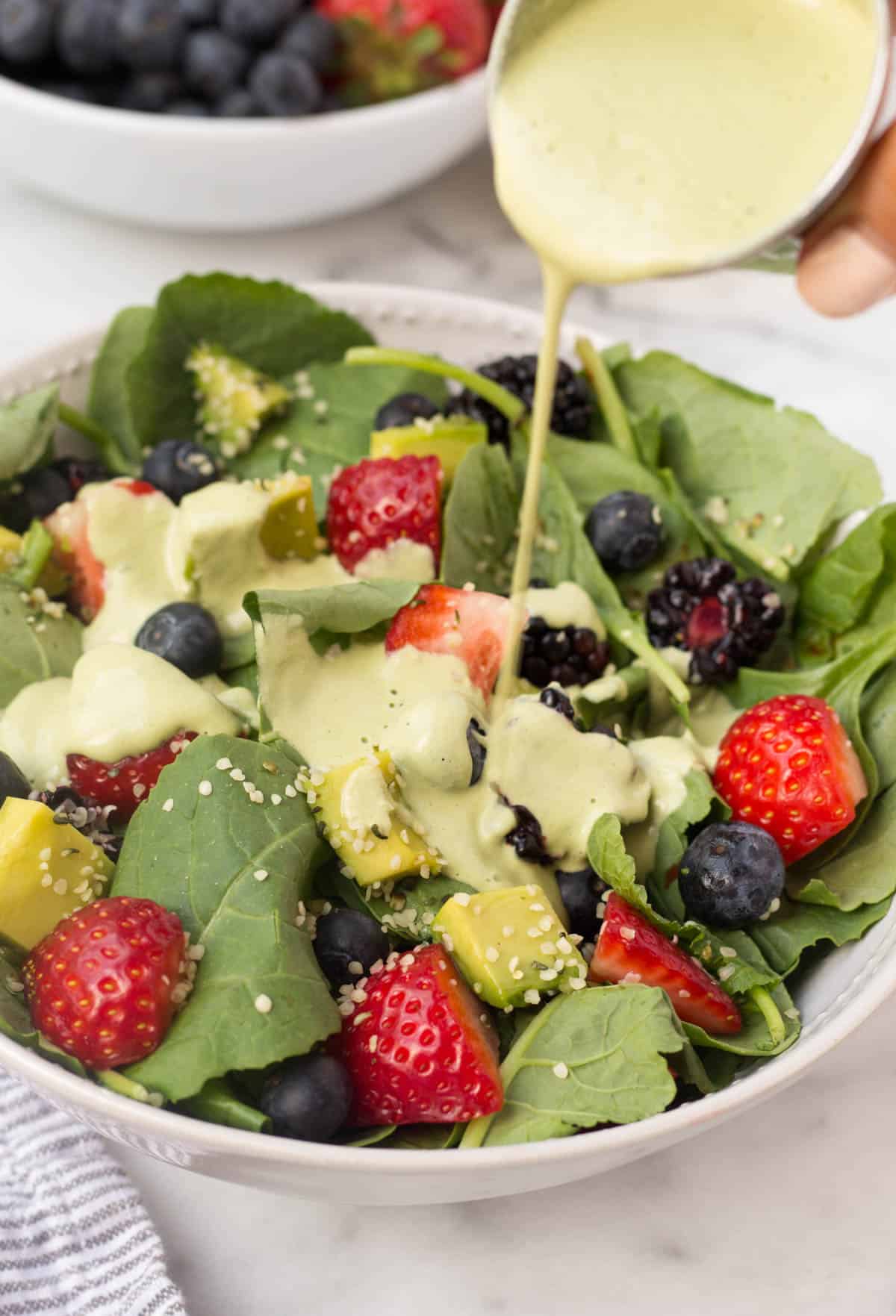 A perfect easy & light end of summer dish, this Berry Avocado Salad with Creamy Matcha Dressing packs the nutrients & is paleo, vegan, dairy free, & Whole30 approved! - Eat the Gains