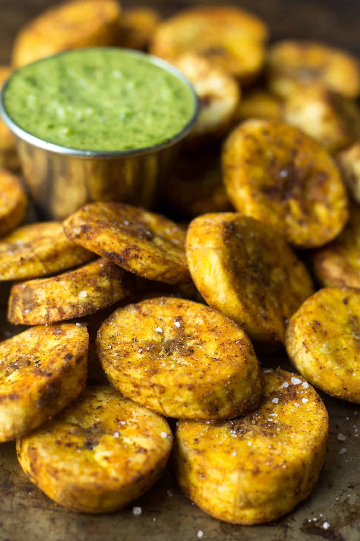 A great carb source, these Sweet & Spicy Baked Plantains are an easy side for breakfast or dinner and are paleo, vegan, and Whole30 approved! - Eat the Gains