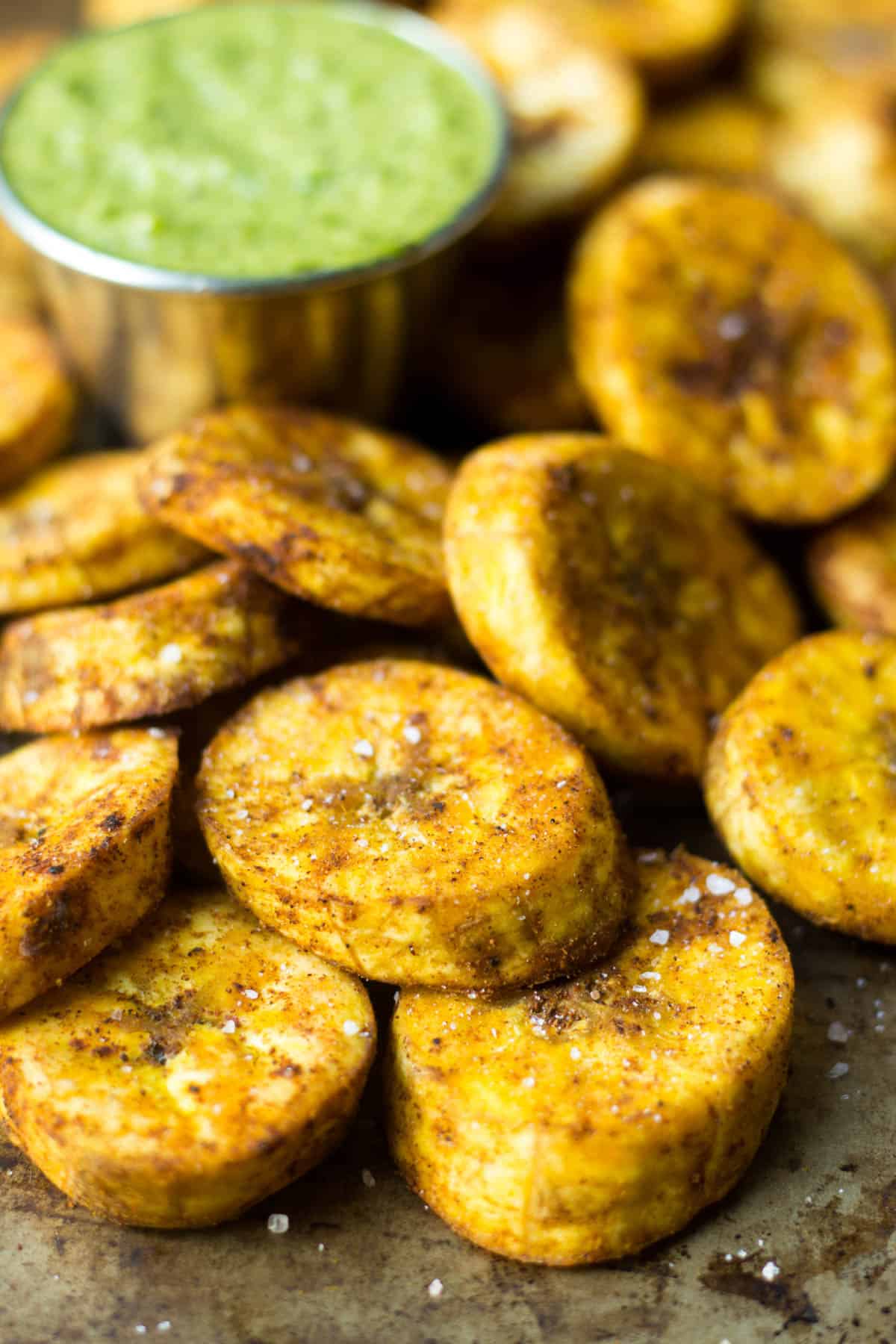 A great carb source, these Sweet & Spicy Baked Plantains are an easy side for breakfast or dinner and are paleo, vegan, and Whole30 approved! - Eat the Gains