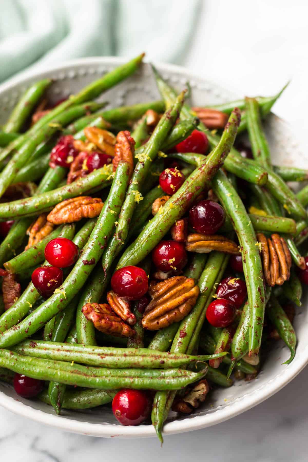These super easy Paleo Holiday Green Beans come together in less than 10 minutes and make the perfect side to your main course - paleo, vegan, and Whole30 approved too! - Eat the Gains