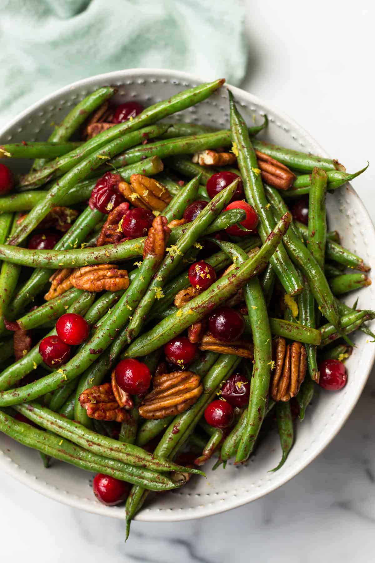 These super easy Paleo Holiday Green Beans come together in less than 10 minutes and make the perfect side to your main course - paleo, vegan, and Whole30 approved too! - Eat the Gains