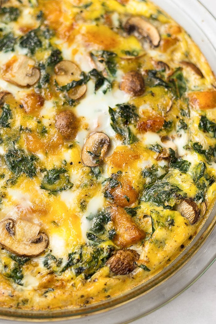 Close up of a crustless Whole30 quiche in a pie pan.