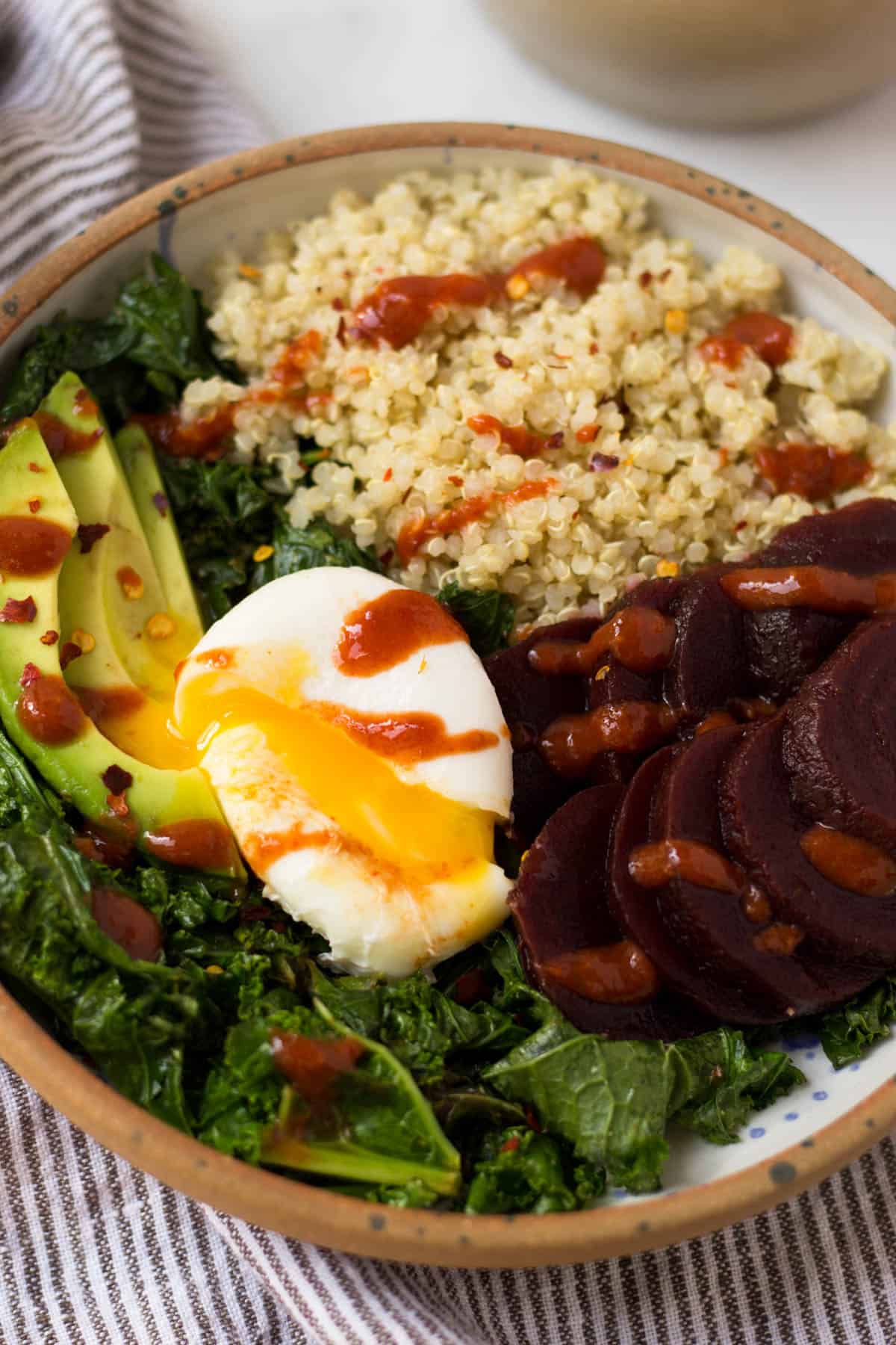 Beet Quinoa Breakfast Bowls come together in under 10 mins and make a healthy and easy gluten free and vegetarian breakfast - great for meal prep or on-the-go! - Eat the Gains