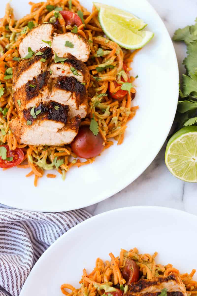 One pan & 30 minutes for this Chili Dusted Chicken & Sweet Potato Noodles with Avocado Sauce. Packed with protein, carbs, and healthy fats to make an easy gluten free, paleo, and Whole30 approved dish - Eat the Gains
