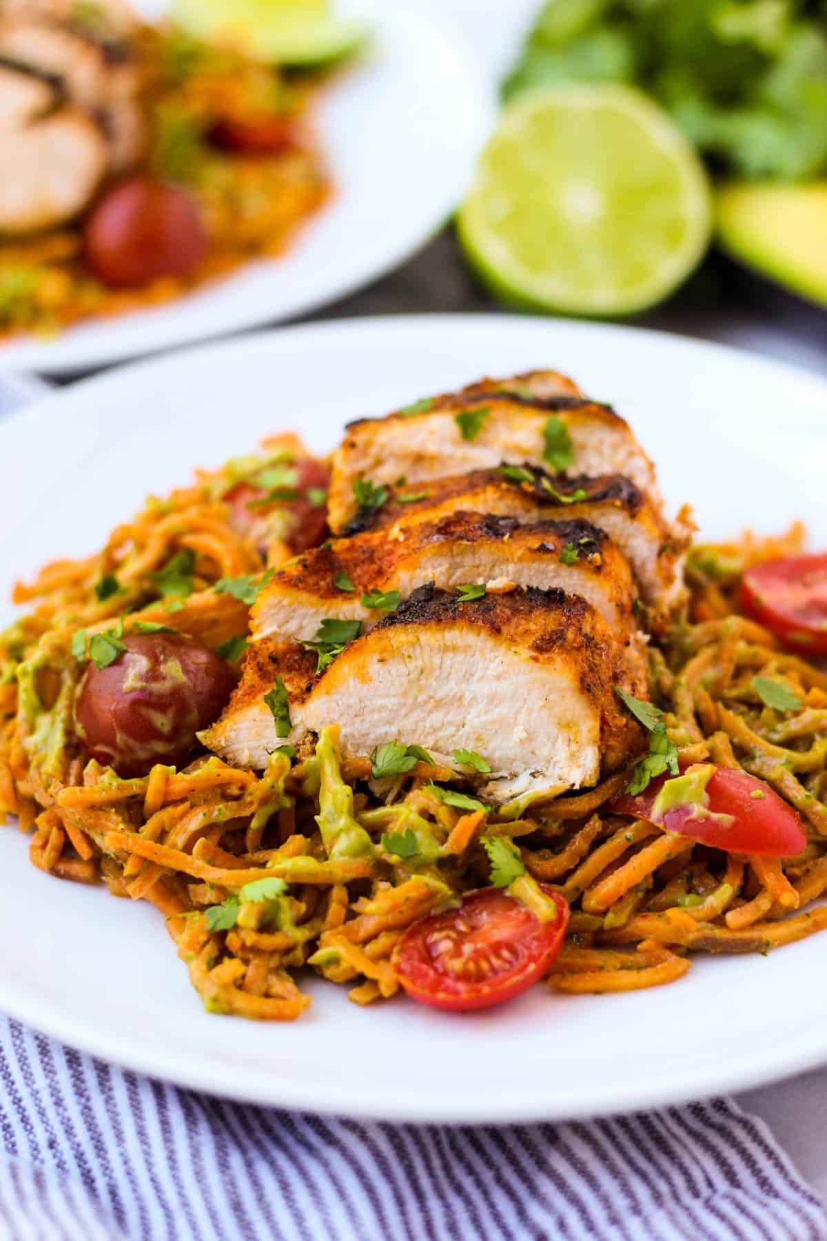 One pan & 30 minutes for this Chili Dusted Chicken & Sweet Potato Noodles with Avocado Sauce. Packed with protein, carbs, and healthy fats to make an easy gluten free, paleo, and Whole30 approved dish - Eat the Gains