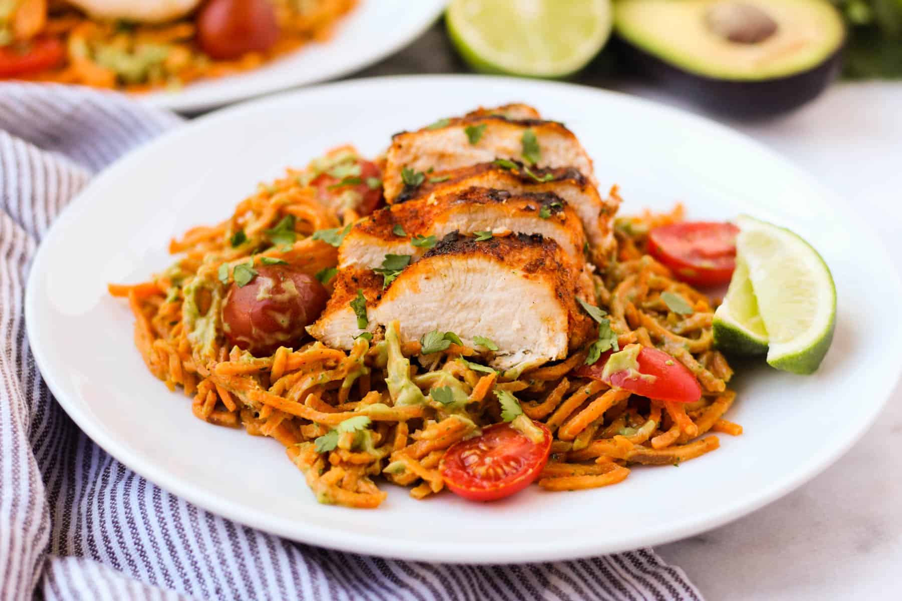 One pan & 30 minutes for this Chili Dusted Chicken & Sweet Potato Noodles with Avocado Sauce. Packed with protein, carbs, and healthy fats to make an easy gluten free, paleo, and Whole30 approved dish - Eat the Gains